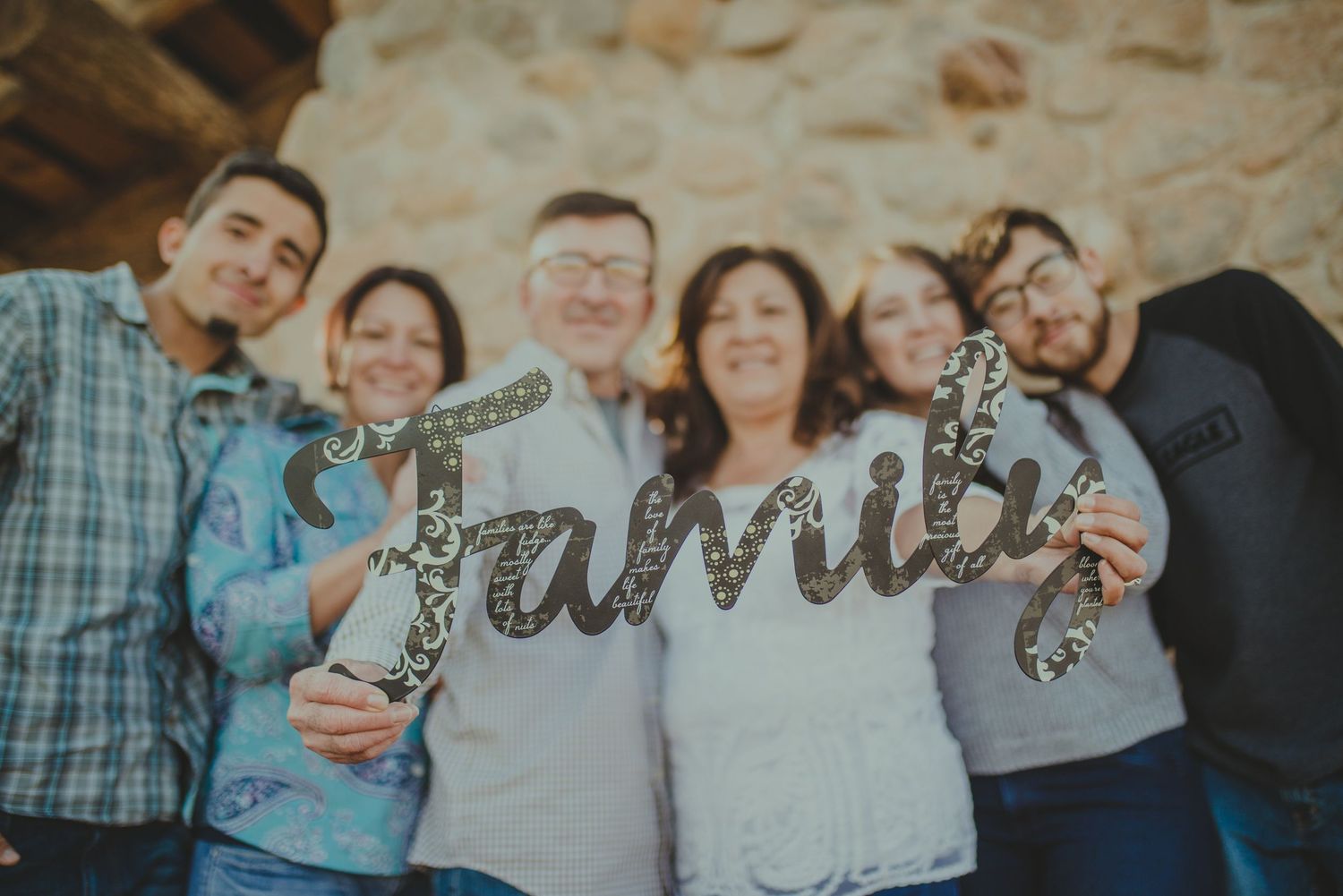 Group photo with decorative script text overlay.