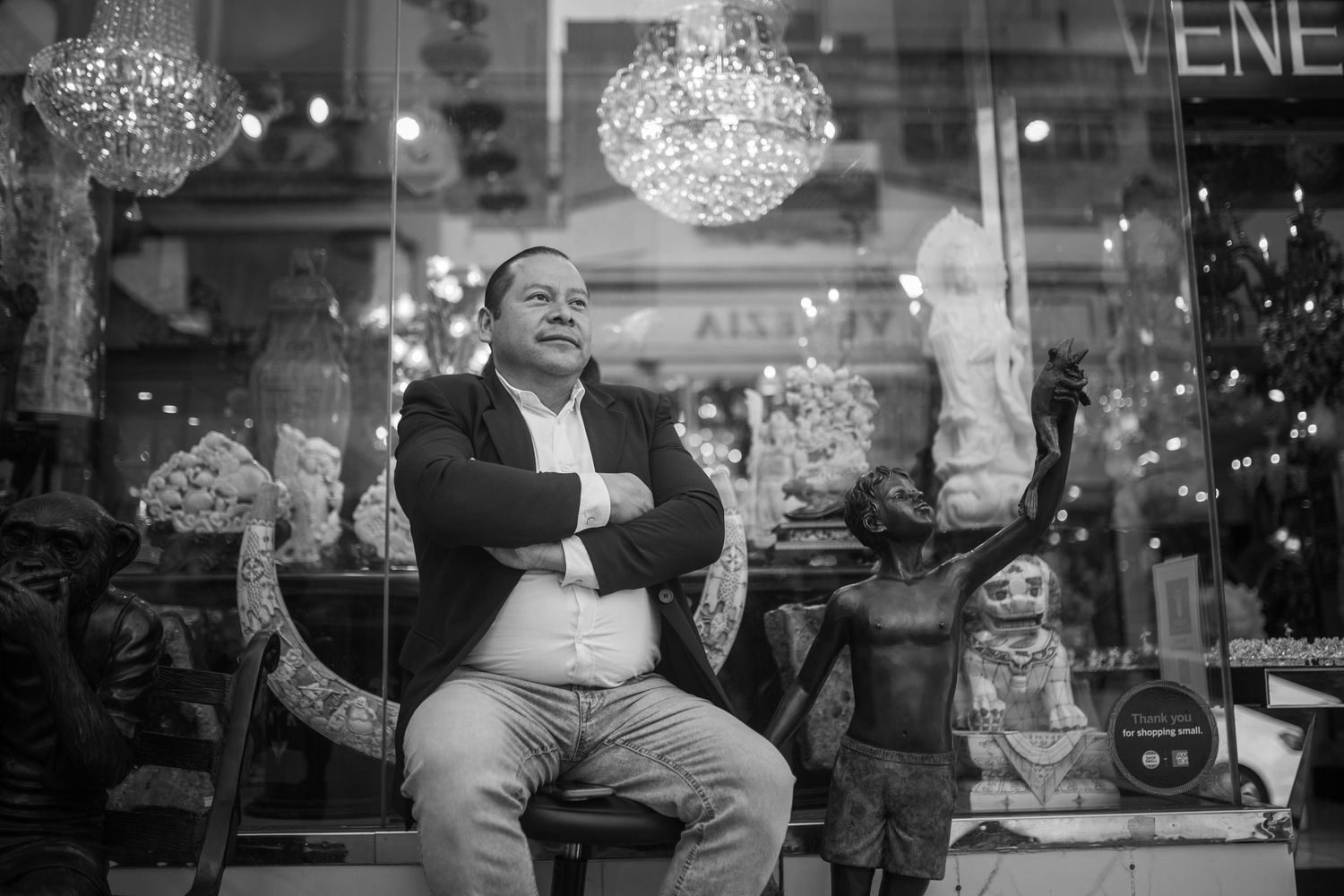 A sequence of black and white photographs showing shoppers and holiday retail scenes arranged in a horizontal strip.