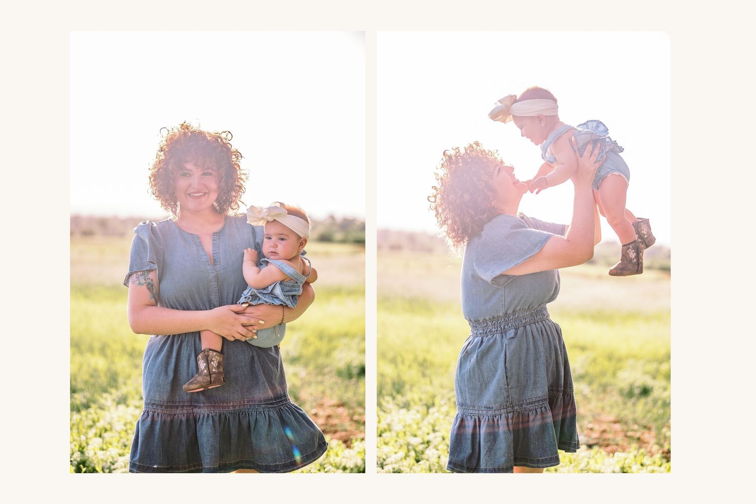 A curly-haired mother in a blue dress holds and lifts her baby girl in a sunny green meadow.