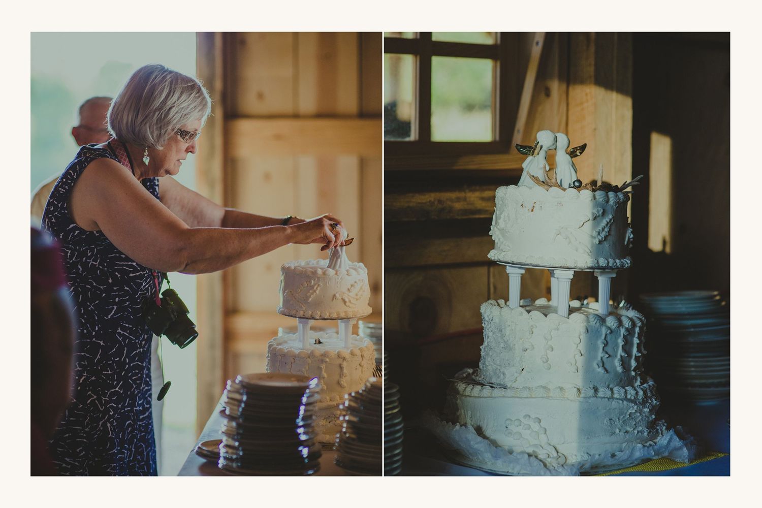 Woman cutting a white three-tier wedding cake with figurine topper at a rustic barn wedding reception.