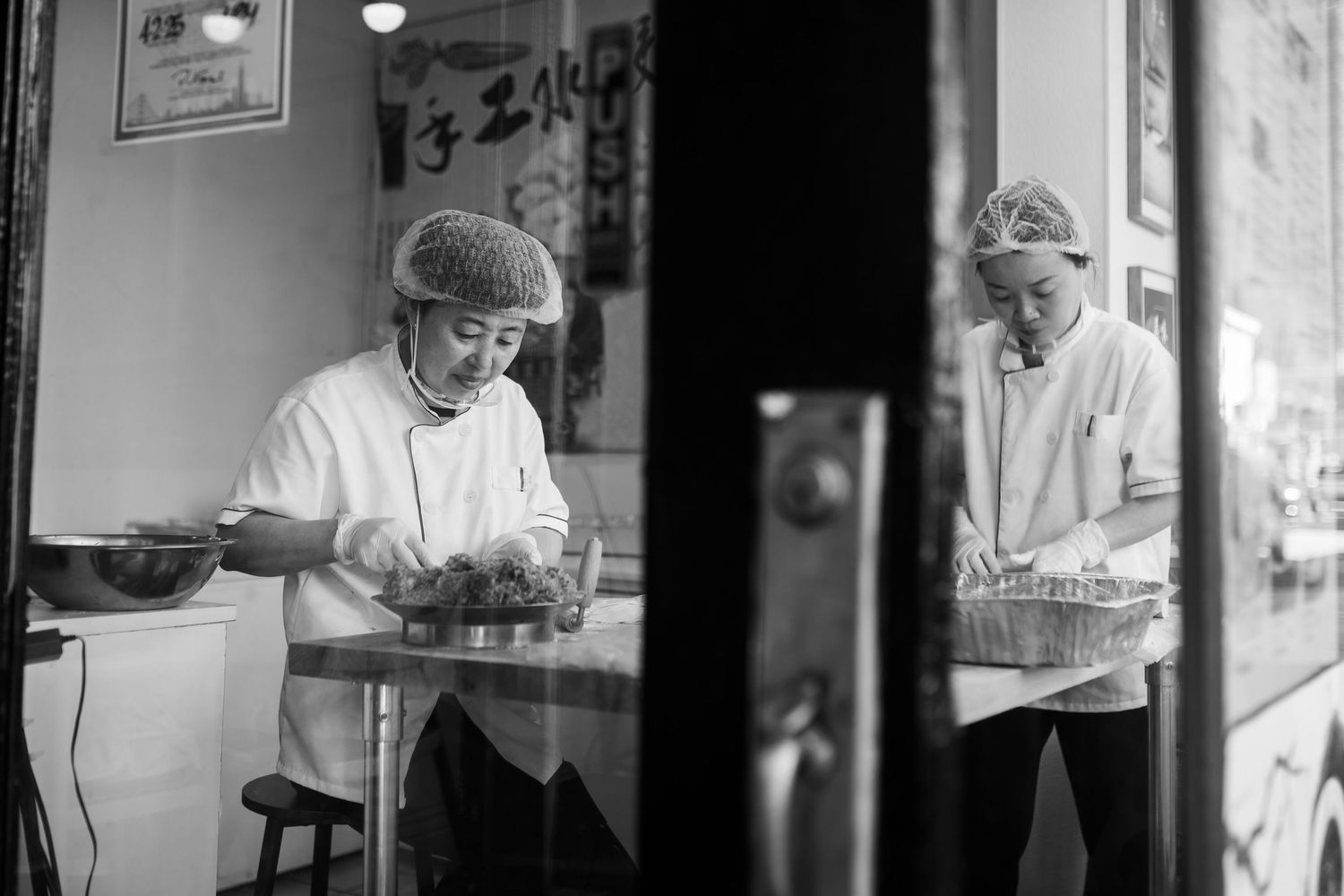 Black and white photo series showing nurses and medical staff working in a hospital environment.