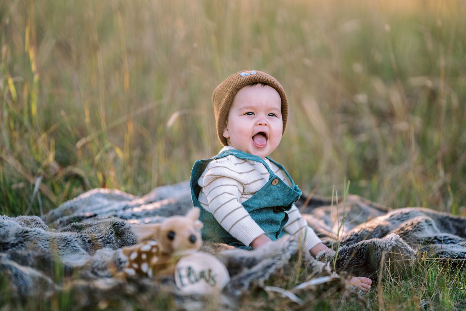 Candid photo of a toddler playing in a sunlit meadow — gentle storytelling by Quiet Light by The Amoras.