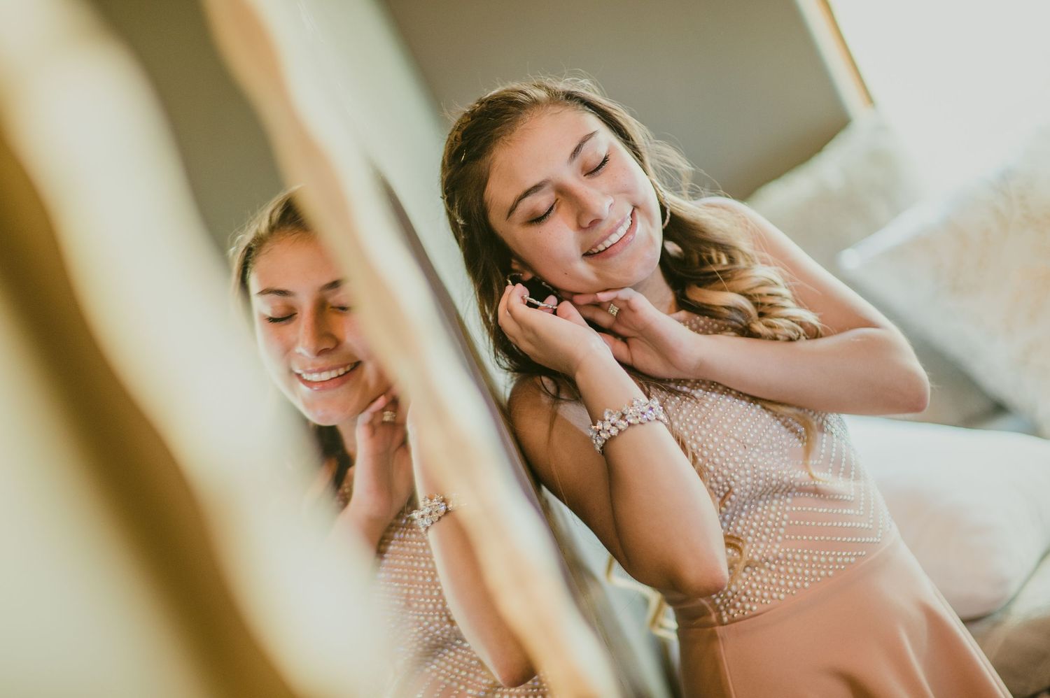 Emotional indoor portrait of a graduating senior with a mirrored reflection — intimate and natural light photography by Quiet Light