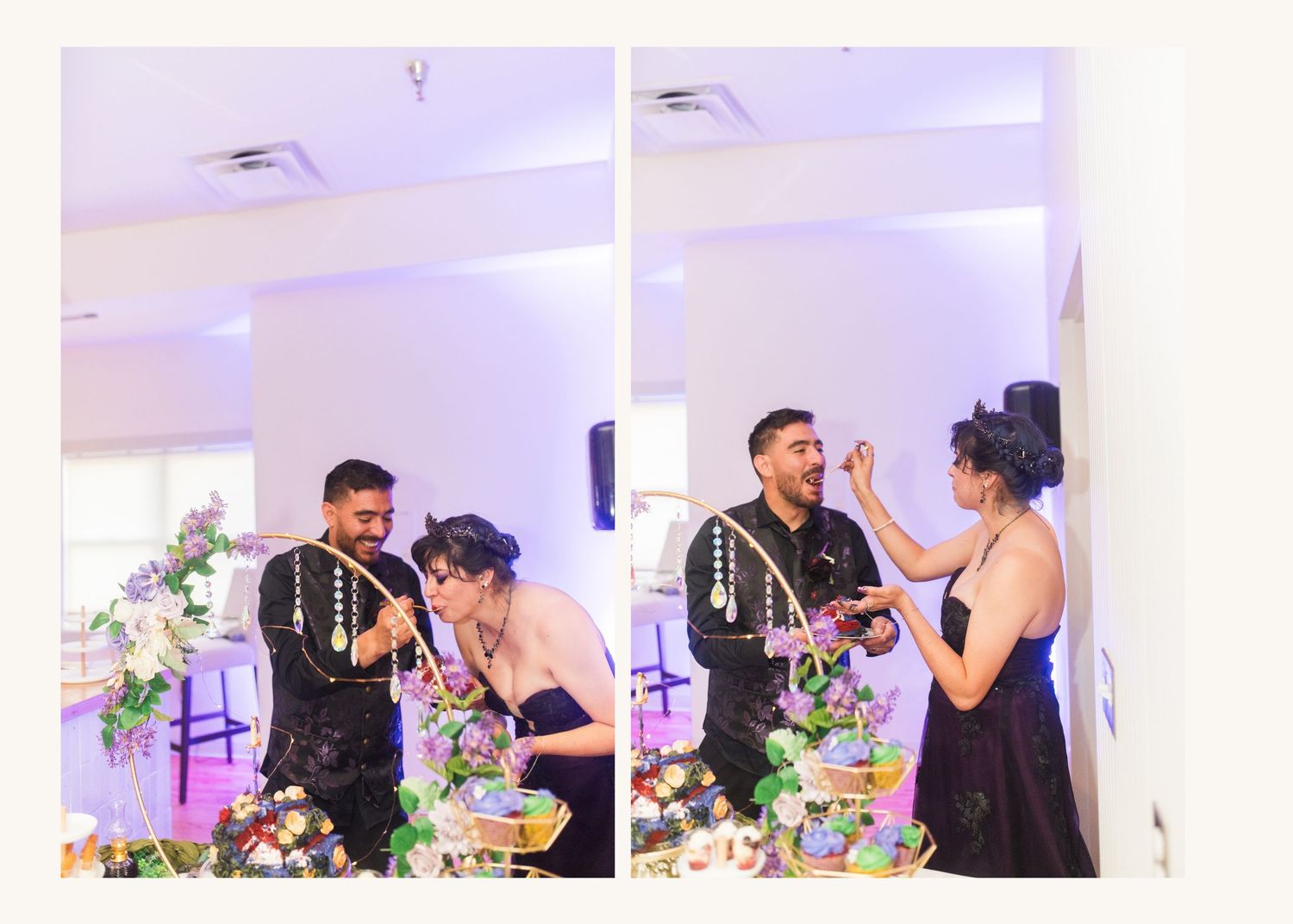 Couple sharing a joyful cake-cutting moment at an elegant wedding reception with floral decorations and purple lighting.
