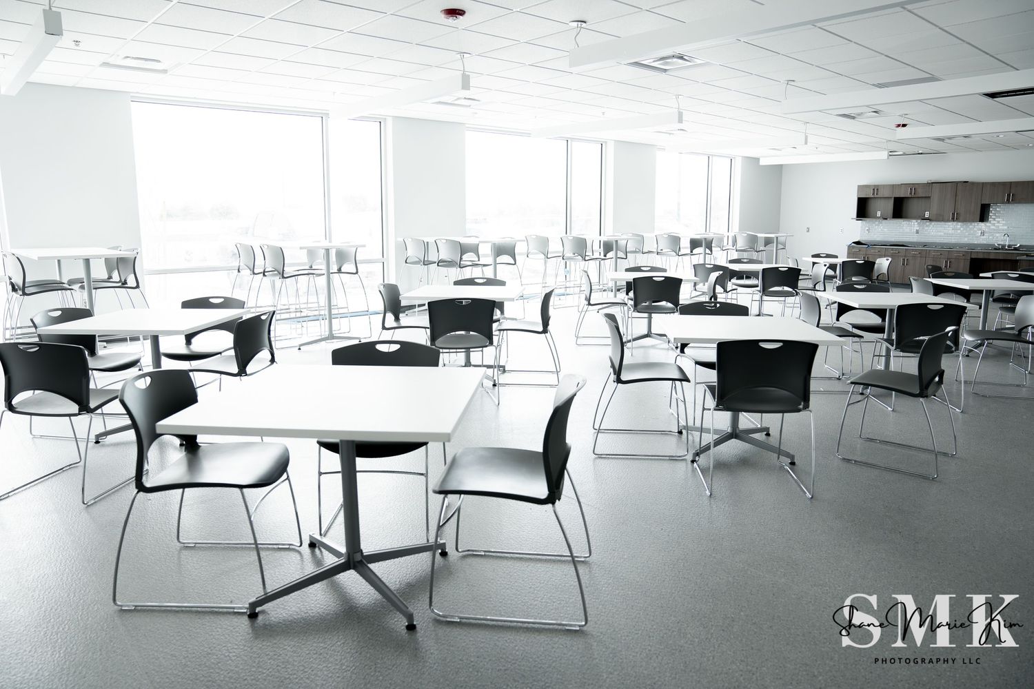 break room area that includes several high-end tables and chairs