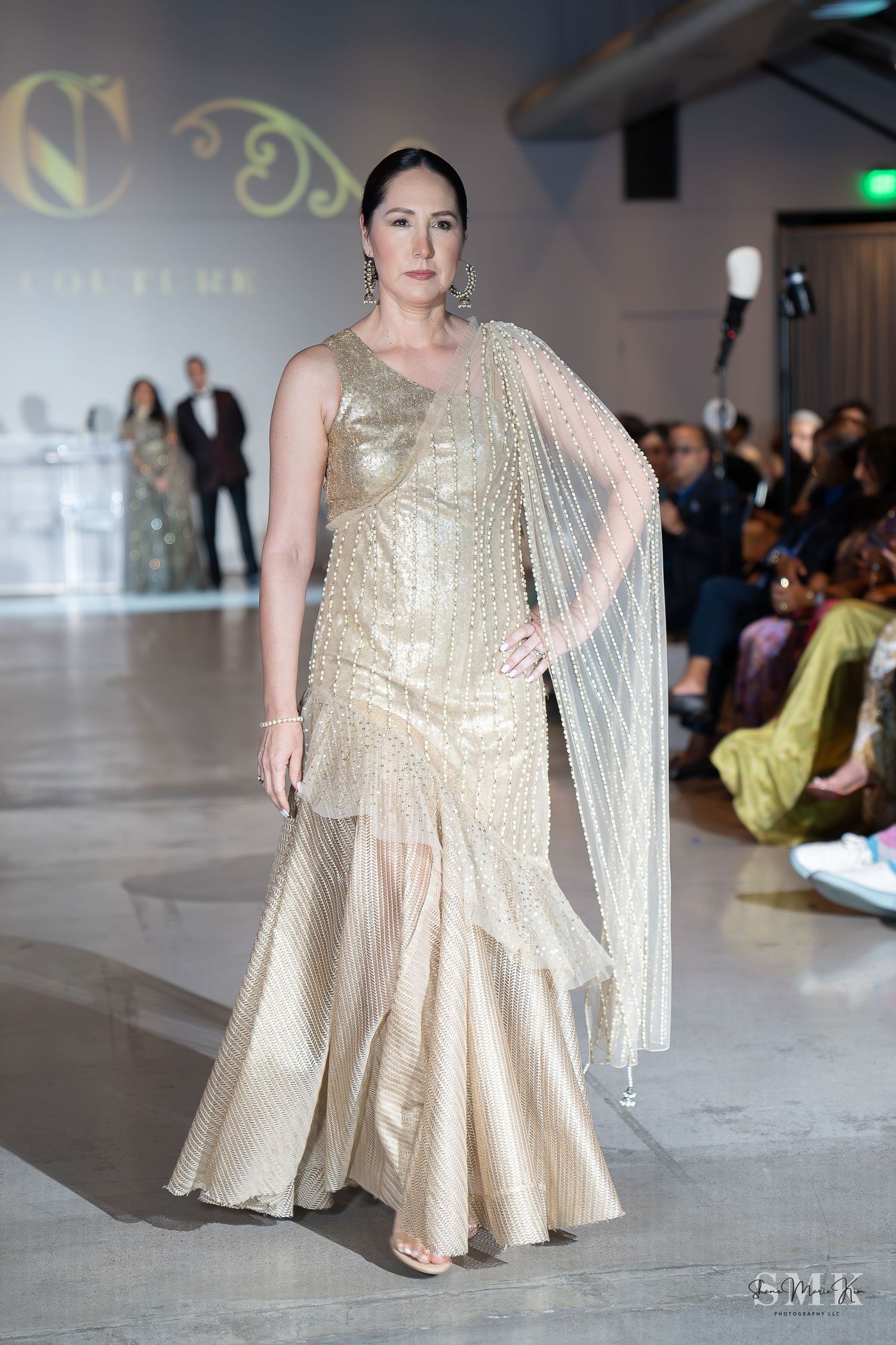 woman wearing an afghan inspired gold sleeveless dress