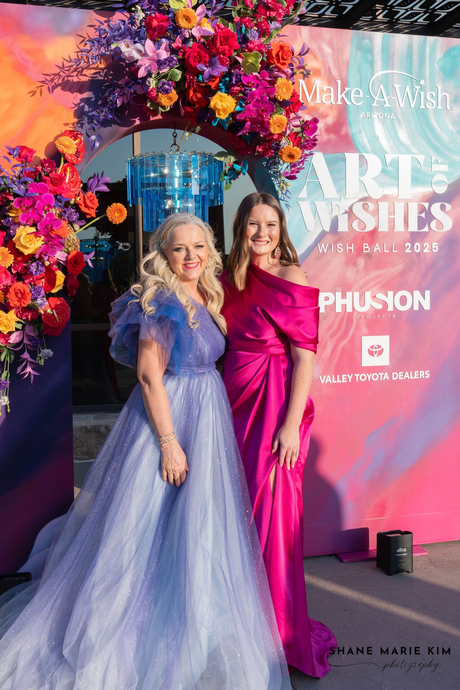 woman wearing a lavender gown, woman wearing a off-the-shoulder reddish pink dress