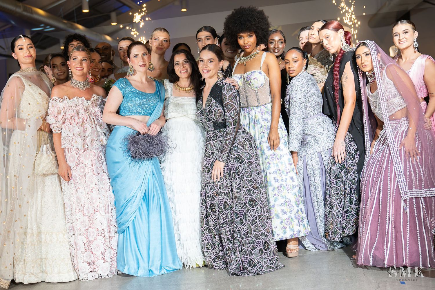 women of many ethnicities in nice colorful dresses