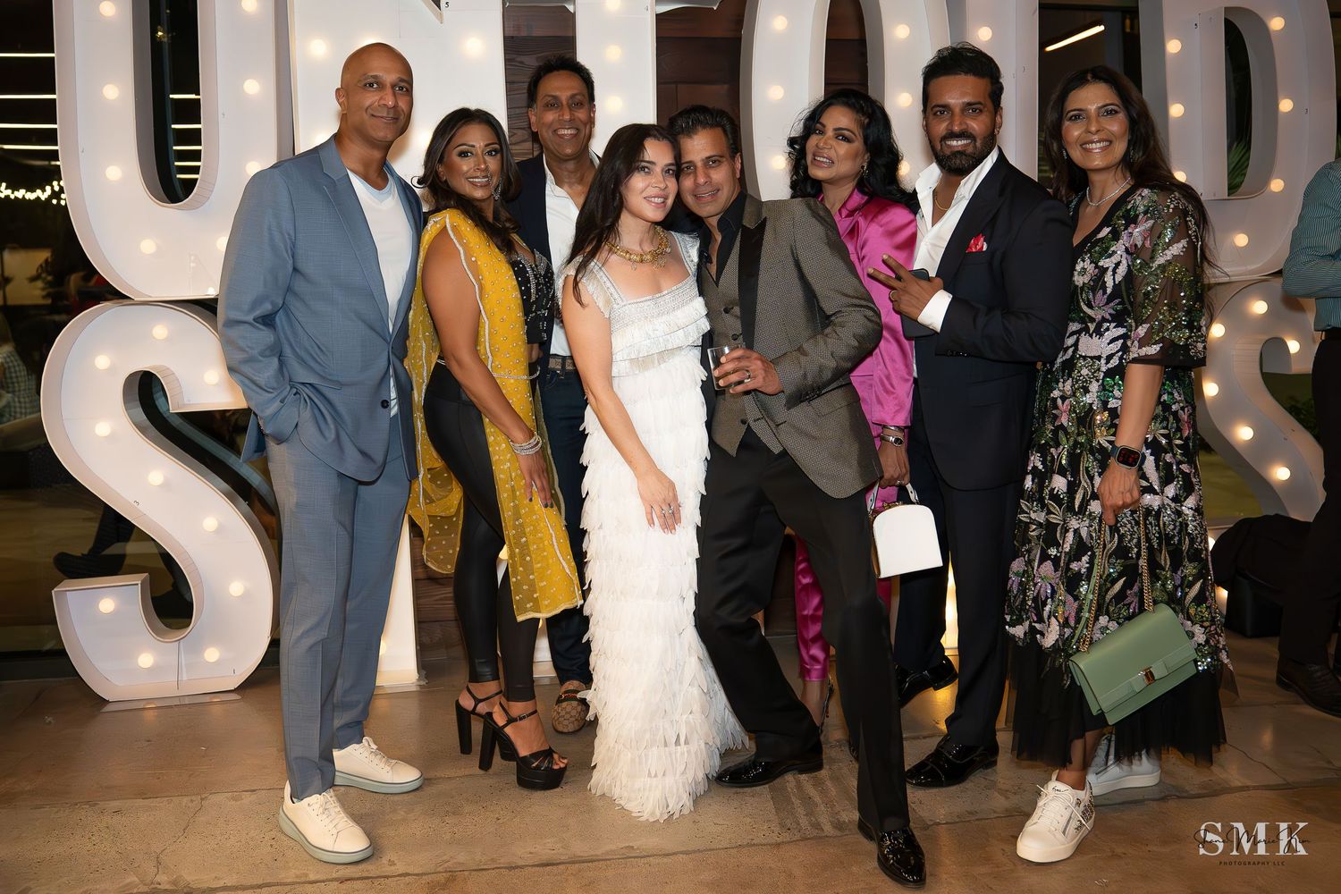 group photo mixed with men and women at a charity event