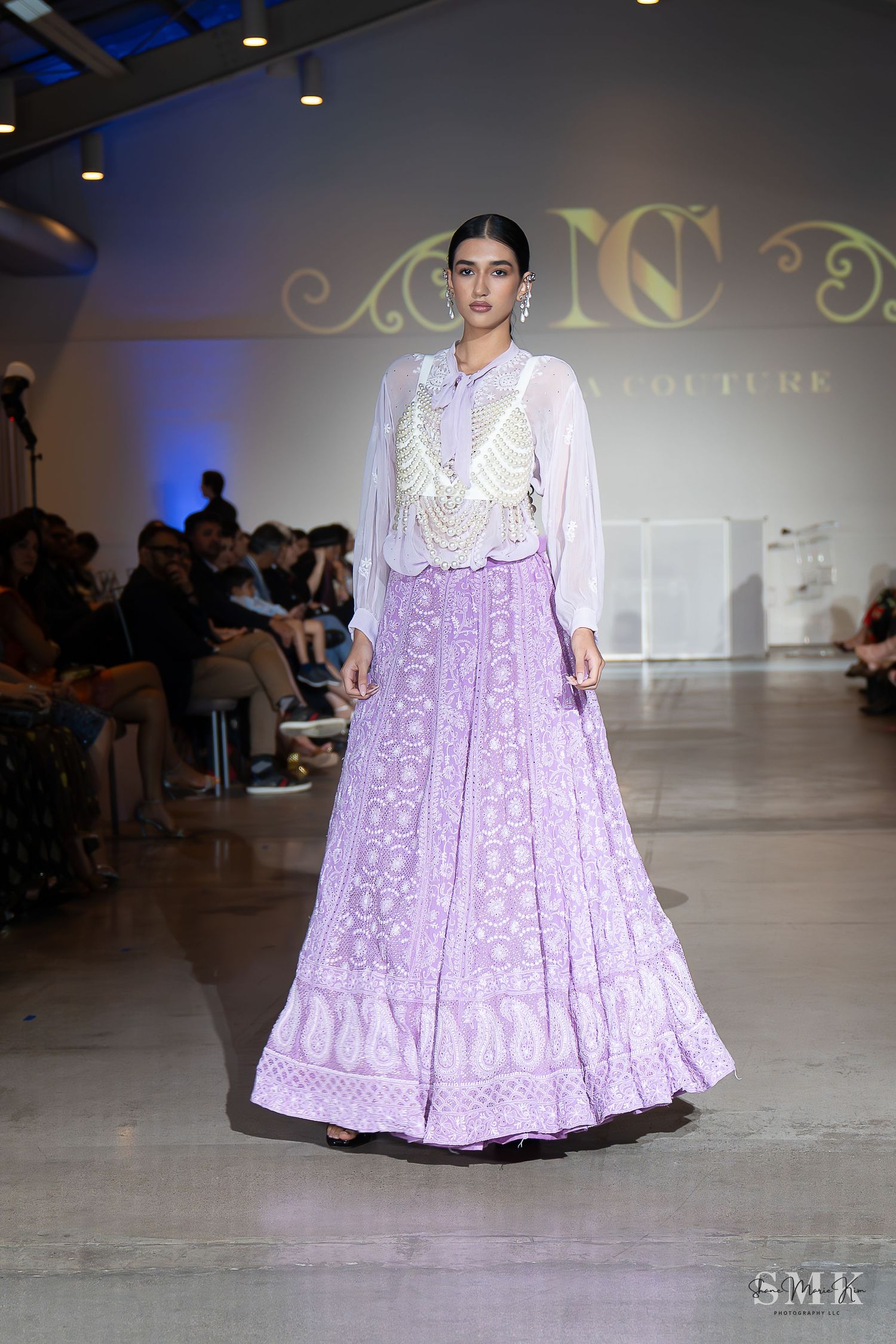 girl wearing a lavender dress with dangling earrings