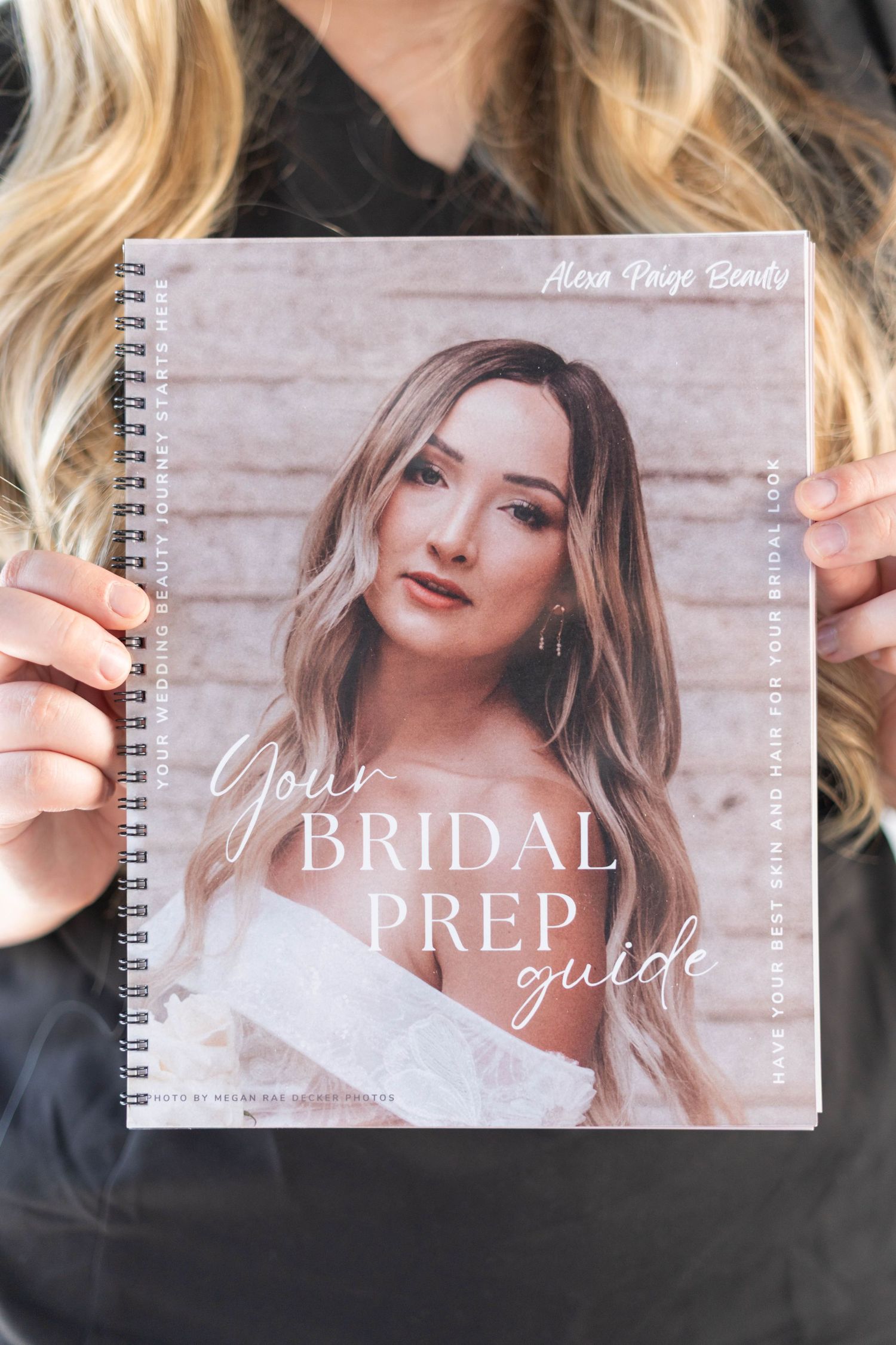 girl holding a bridal prep guide, girl hold a make up bridal prep guide