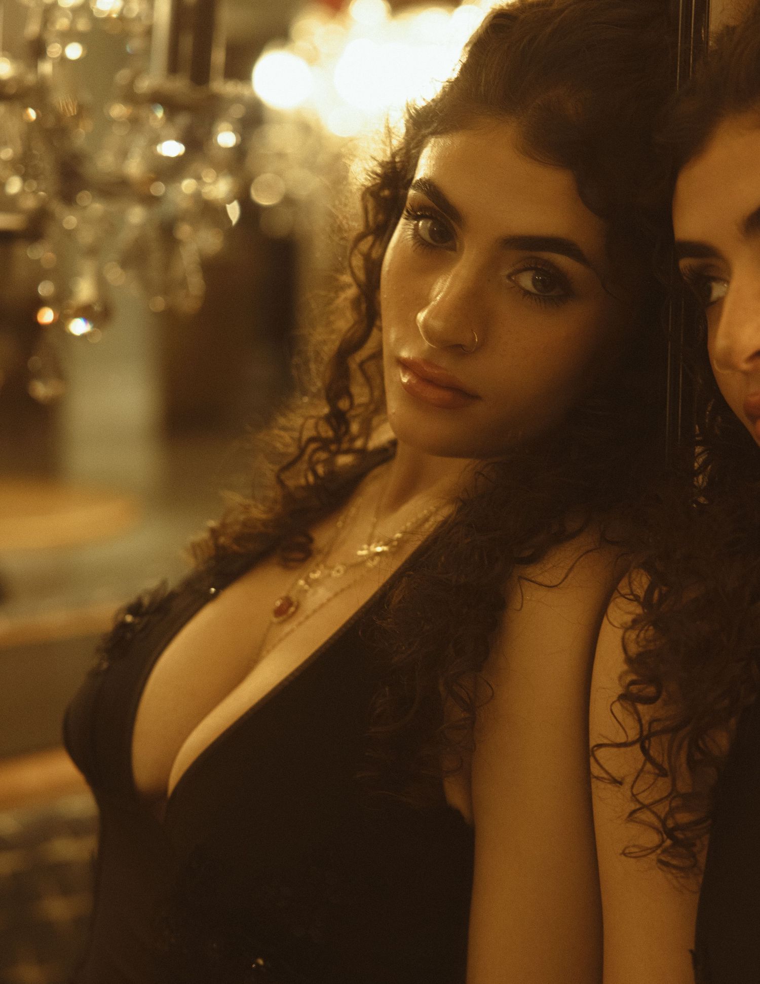 Atmospheric portrait series in warm golden lighting with dramatic shadows.