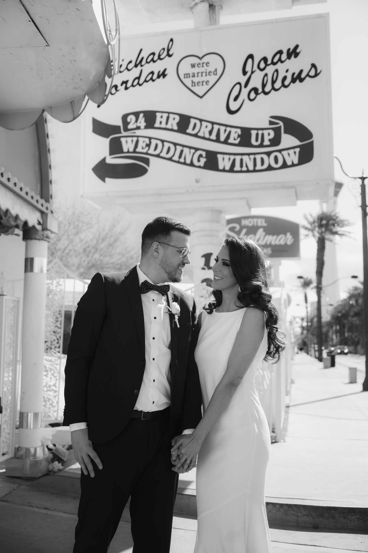Black and white photos of newlyweds at retro wedding chapel with vintage signage.