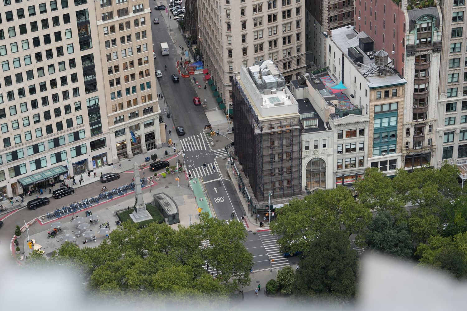 Aerial view of dense urban buildings and streets in a major city downtown district.