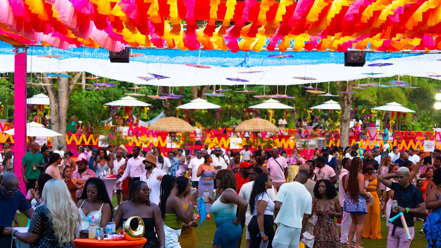 Colorful festival canopy with bright red and yellow fabric stretching overhead.