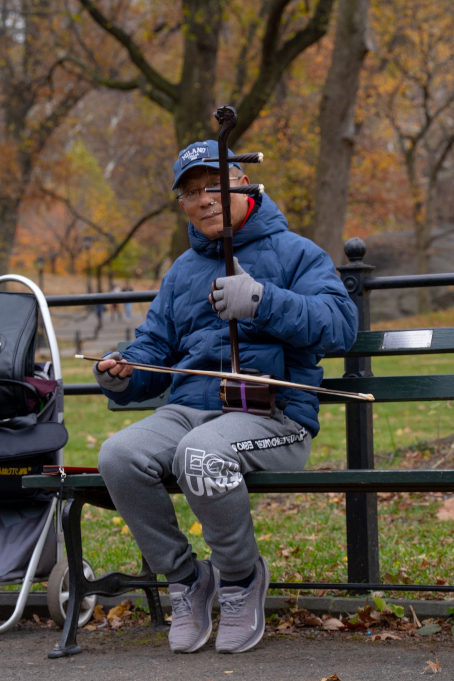 A sequence of images showing someone resting on a park bench with autumn foliage in the background.