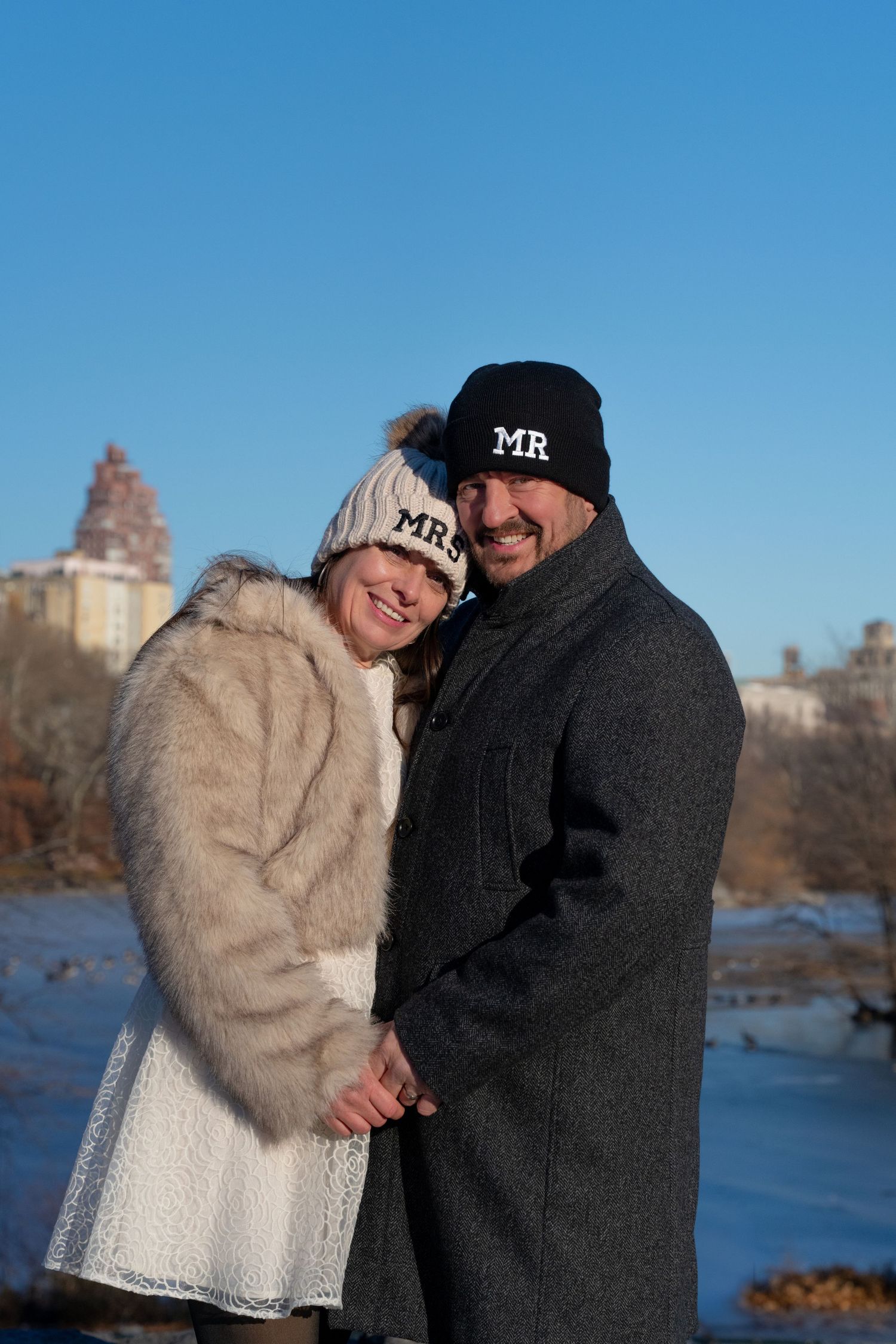 A couple in winter attire wearing matching 