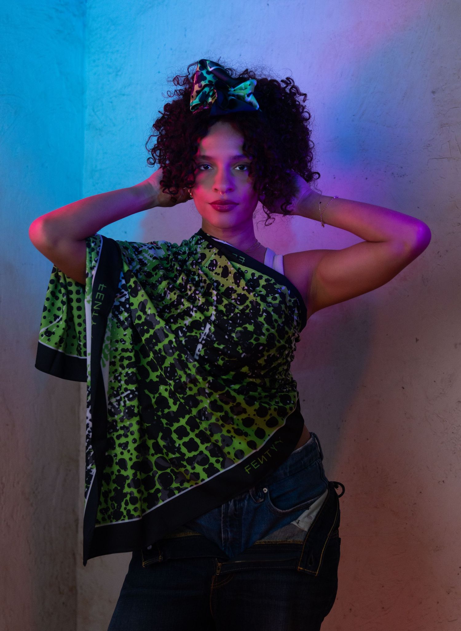 A series of moody portraits in blue and red lighting showing dramatic poses against a dark background.
