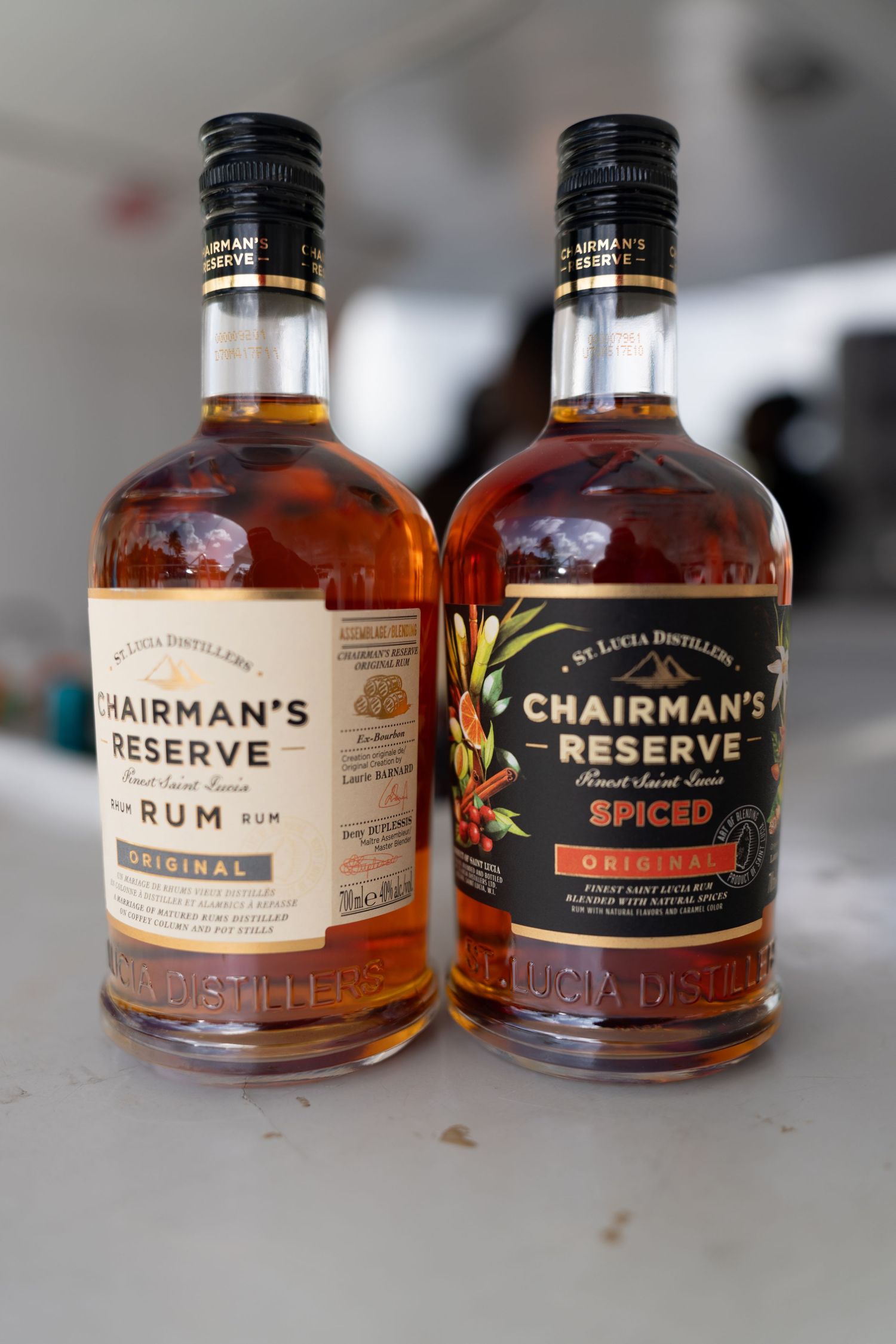 Multiple bottles of Chairman's Reserve rum displayed on a light surface showing different varieties.