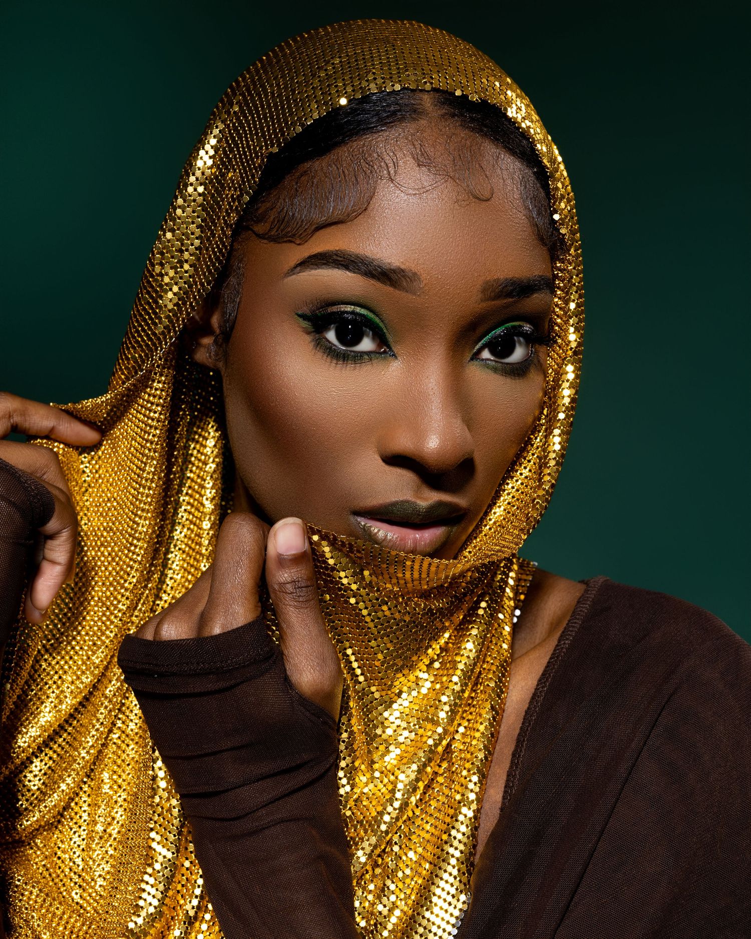 Dramatic fashion portraits with gold sequined headpiece against dark background.