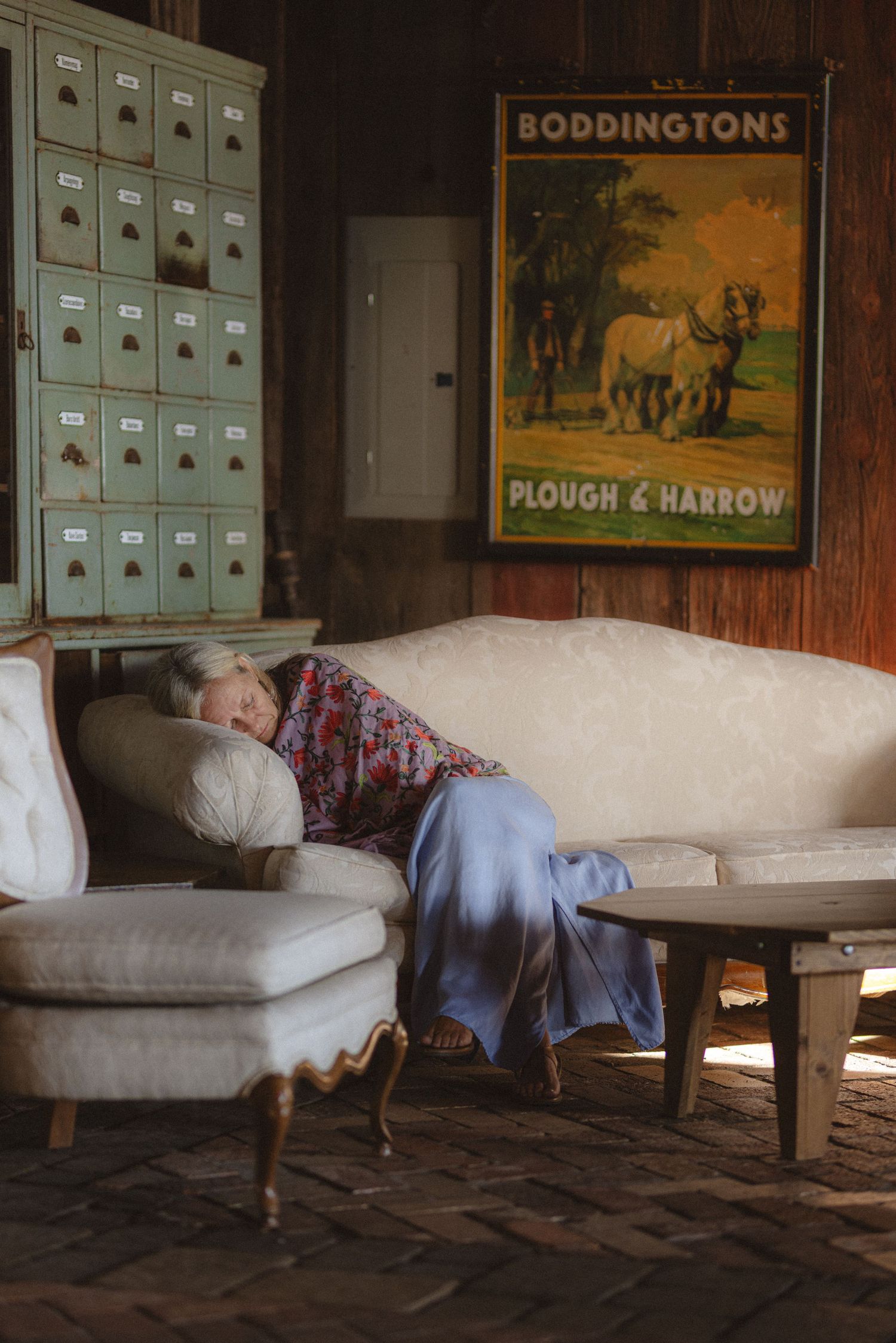 Documentary moment of the mother resting at a Spring Ranch wedding in Mendocino, California, by Sammy Aucella Photography
