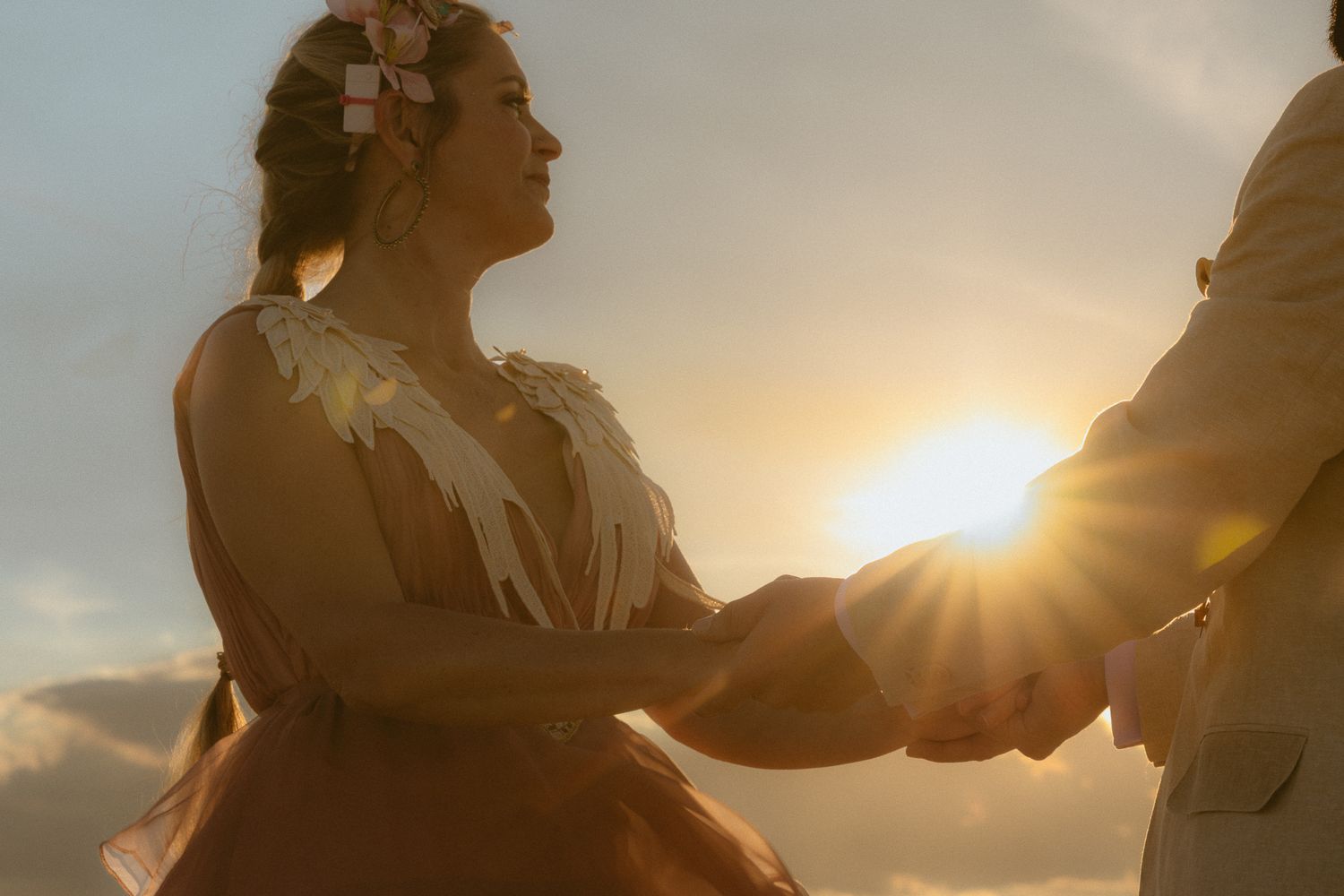 Intimate couple at sunset beside the water, by Sammy Aucella Photography