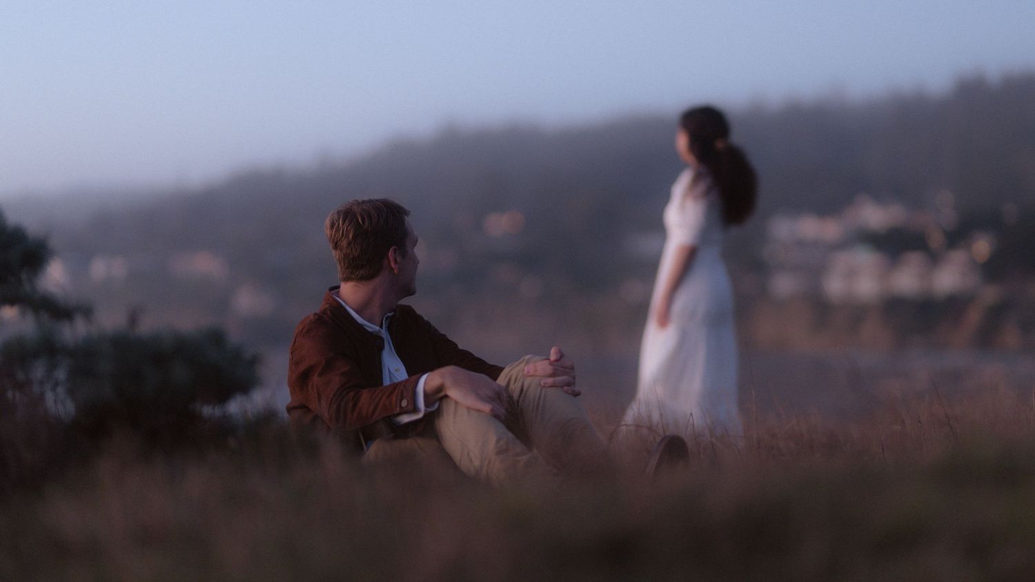 Woman with curly hair at sunset during engagement session in Gualala California Mendocino CA by Sammy Aucella Photography