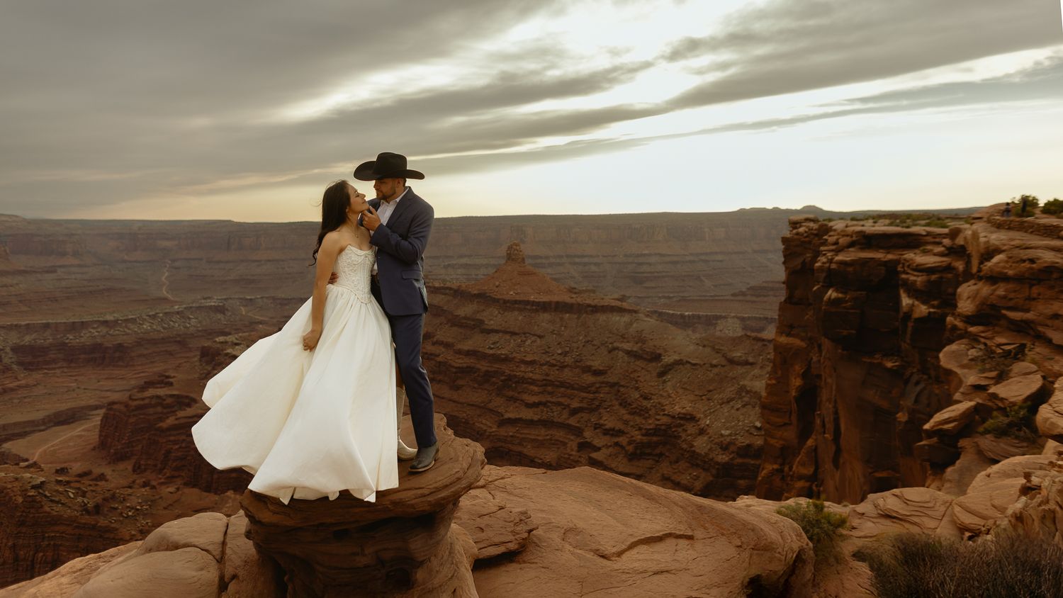 Artistic adventure portrait of the couple at Dead Horse Point in Moab, Utah, by Sammy Aucella Photography