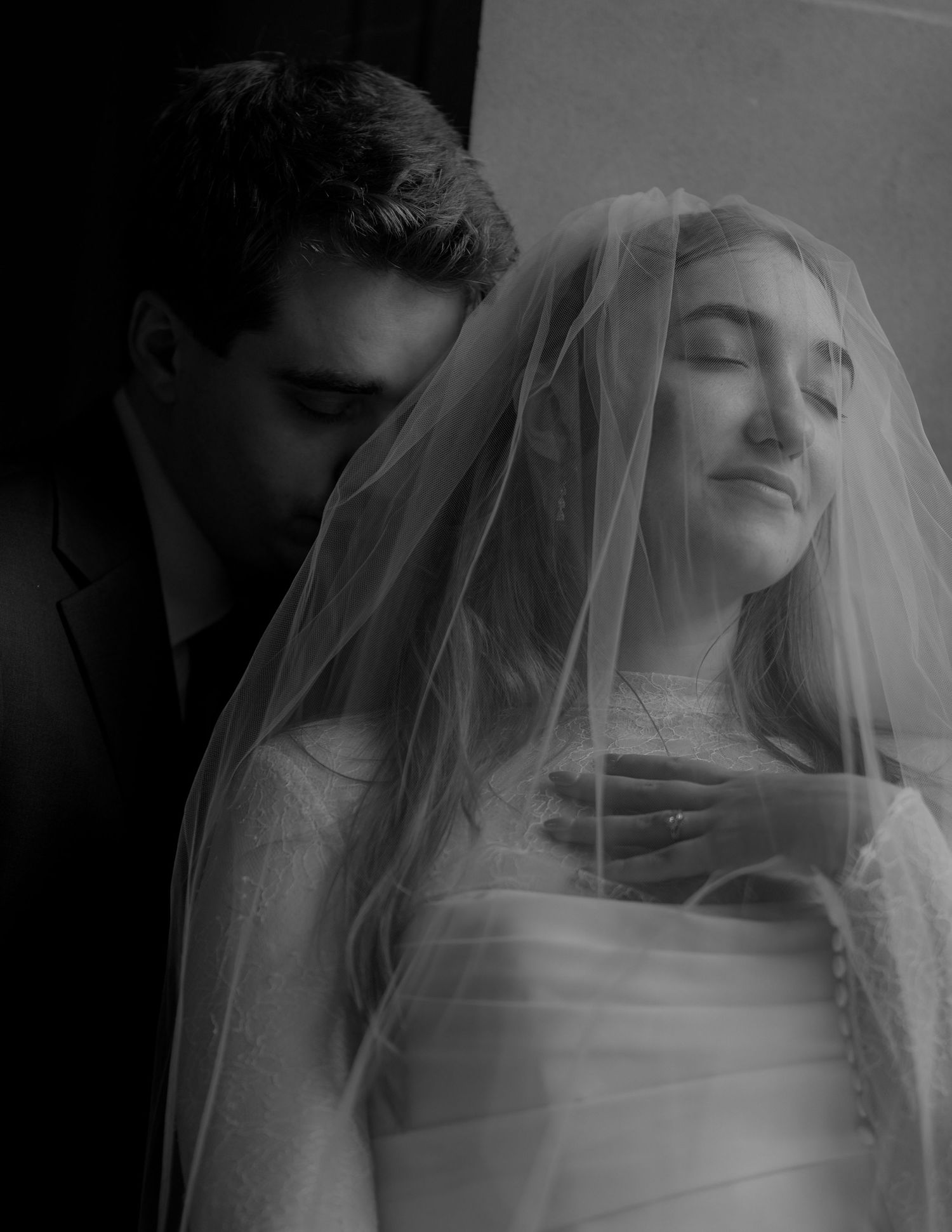 Bride beneath her veil in a romantic portrait at a San Francisco City Hall elopement, by Sammy Aucella Photography