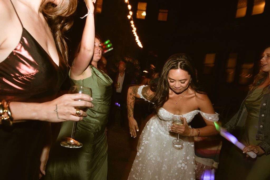Black and white candid of a guest with a cocktail at a luxury wedding reception, by Sammy Aucella Photography