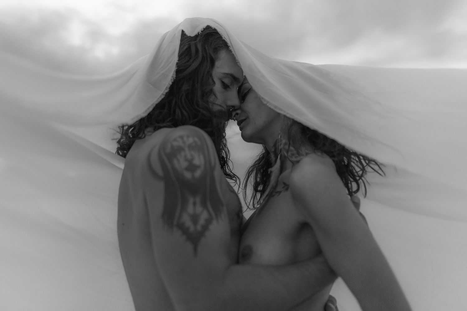 Tasteful nudity couple in love Bonneville Salt Flats in Salt Lake City, UT. Artistic Direction and photography by Sammy Aucella Photography.
