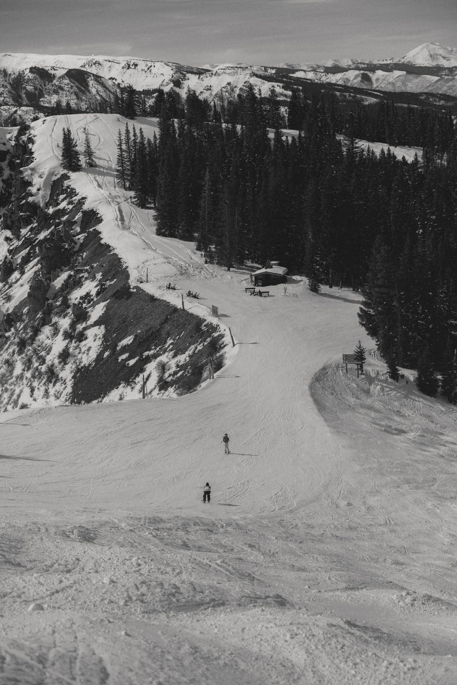 Aerial black and white view of Aspen ski runs and trails in Colorado perfect for luxury engagement photography by Sammy Aucella Photography