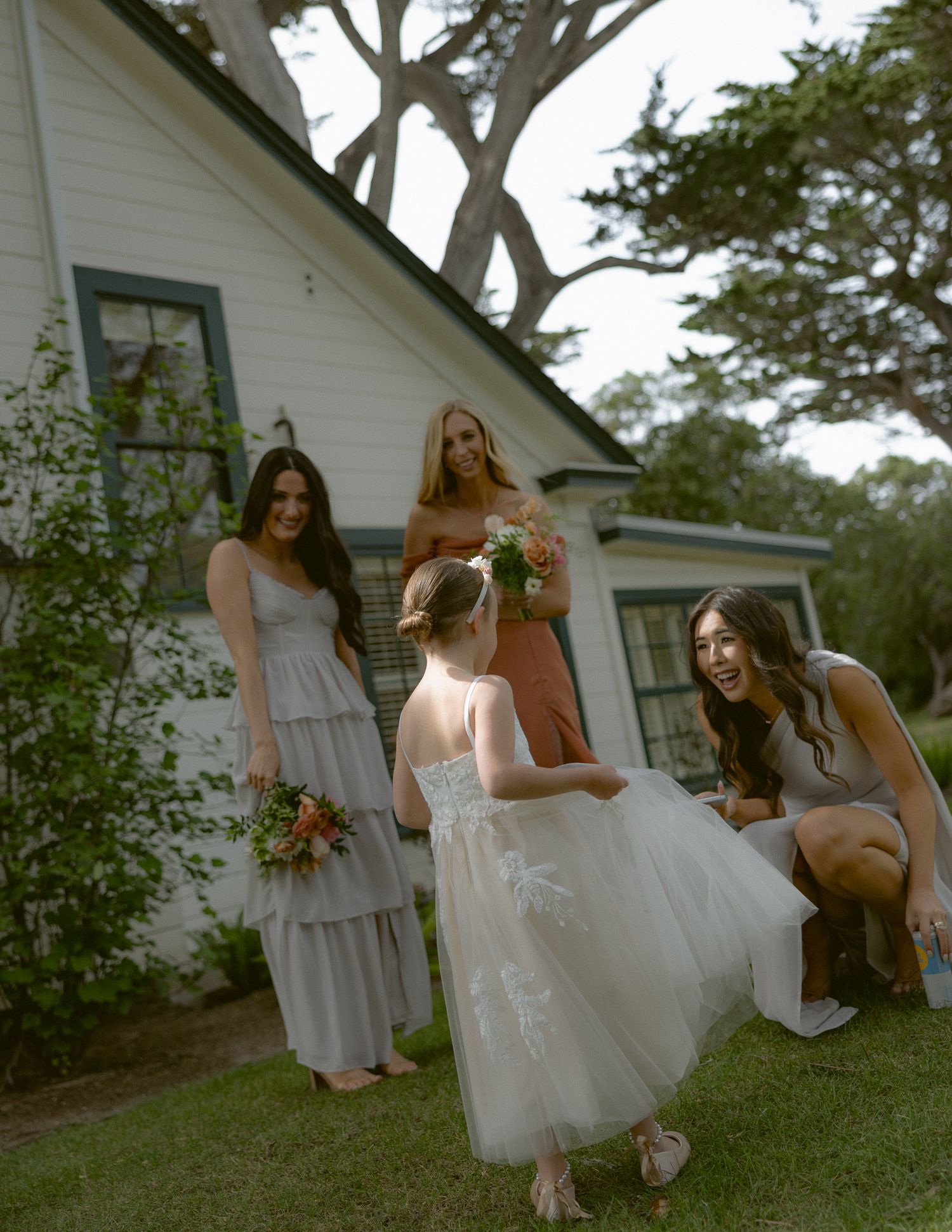 Flower girl and bridesmaids in mauve gowns at a Mission Ranch luxury wedding in Carmel, California, by Sammy Aucella Photography