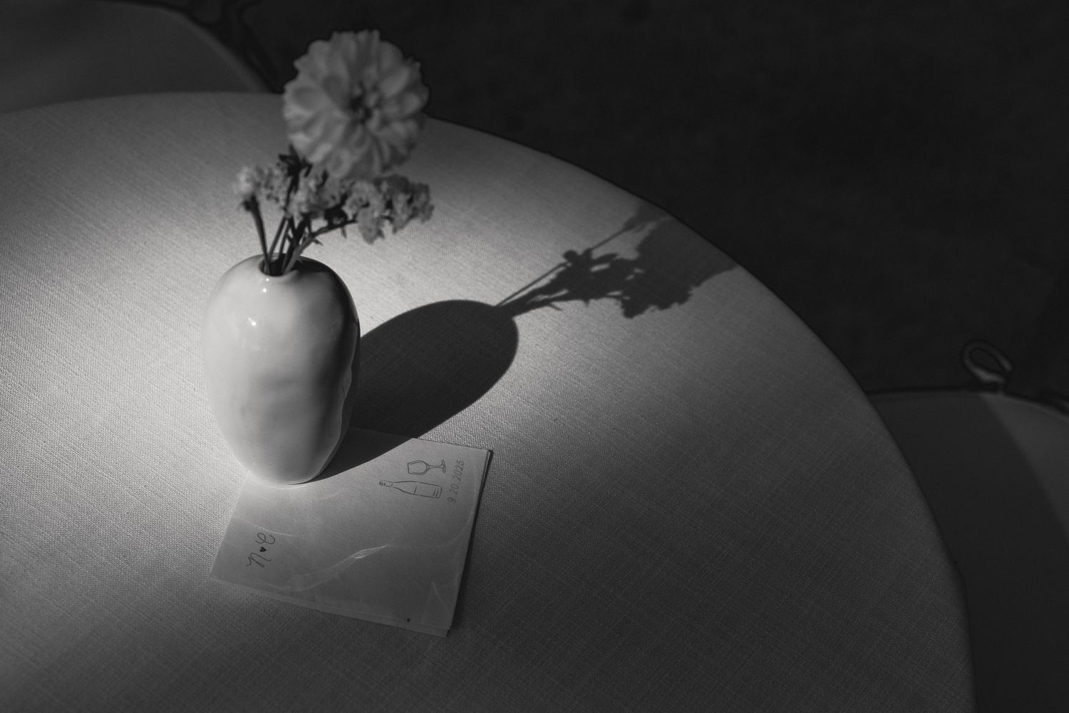 Black and white still life of a heart-shaped wedding detail at a luxury wedding, by Sammy Aucella Photography