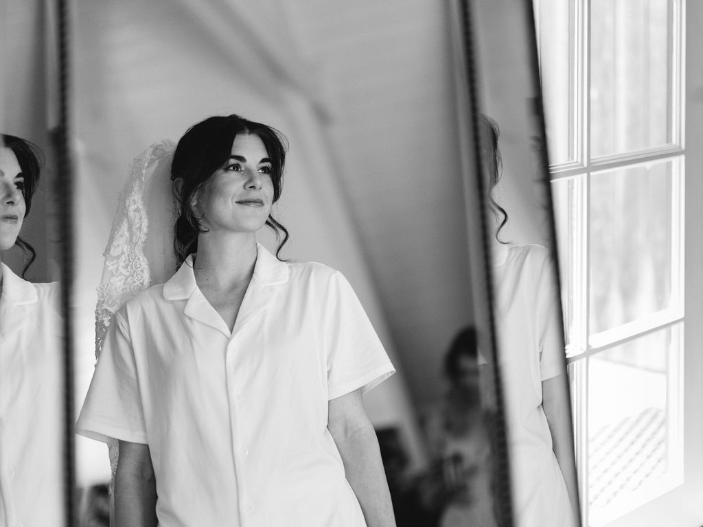 Black and white bridal portrait in window light at a MacCallum House wedding in Mendocino, California, by Sammy Aucella Photography
