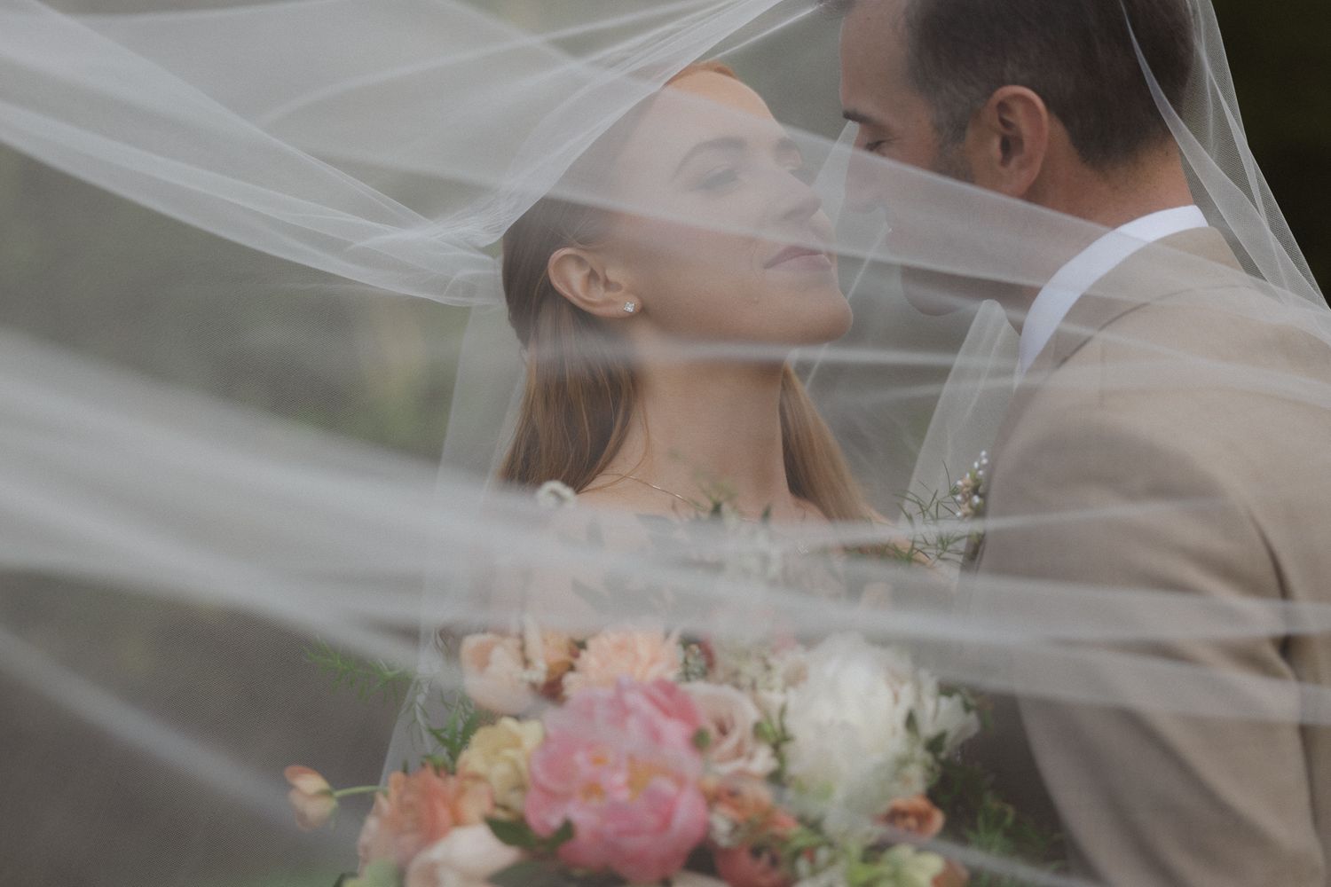 Romantic portrait of the bride beneath her veil at a Mission Ranch wedding in Carmel, California, by Sammy Aucella Photography
