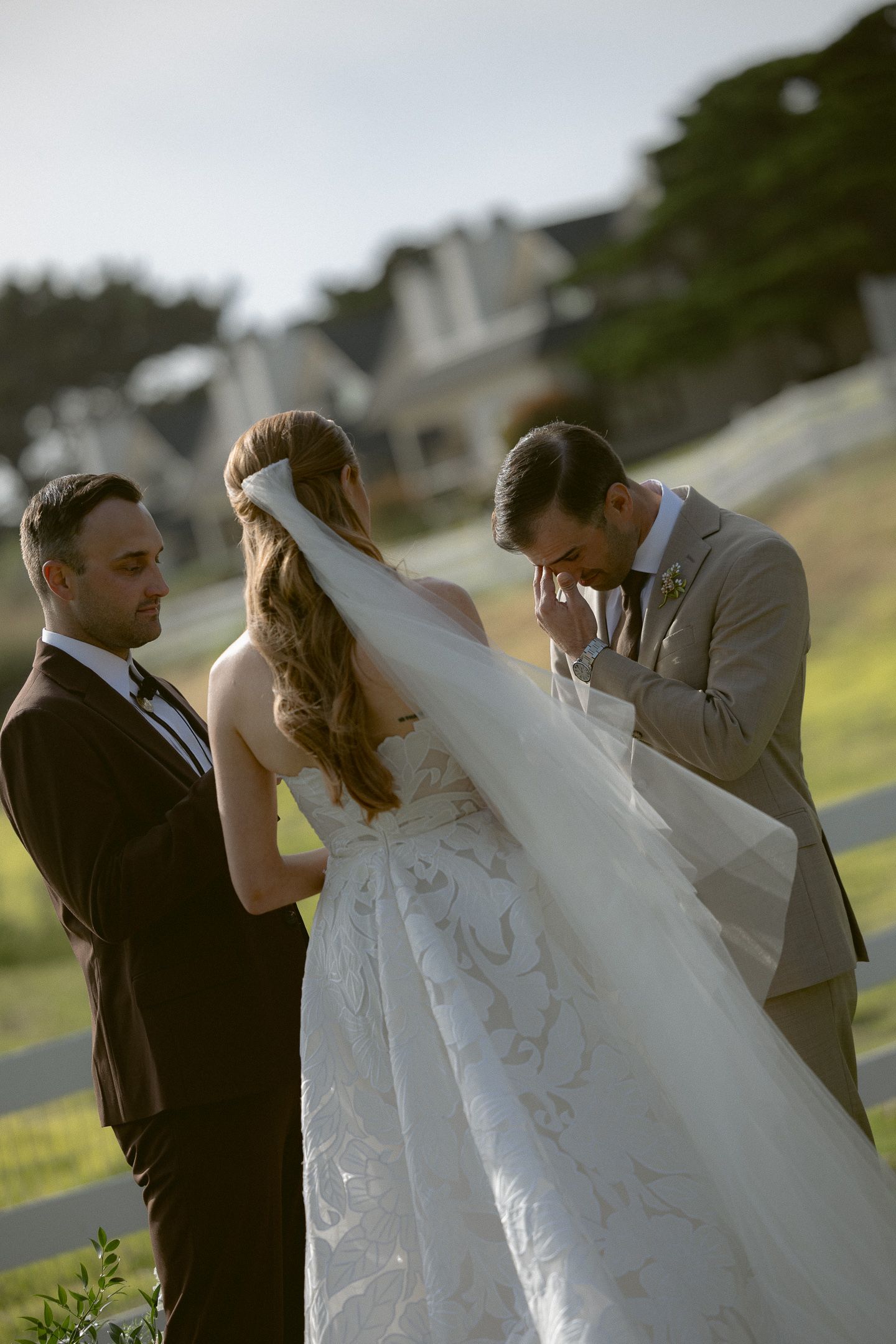 Groom emotional as the bride lifts her veil at a Mission Ranch ceremony in Carmel, California, by Sammy Aucella Photography