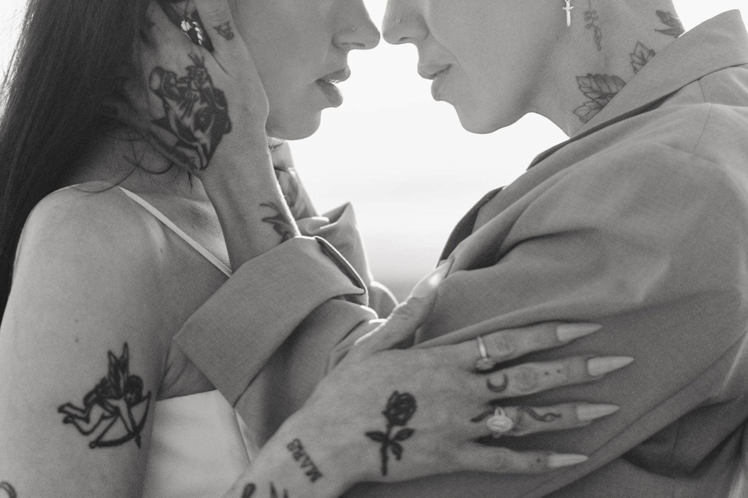 Black and white couple touching foreheads at an adventure elopement, by Sammy Aucella Photography