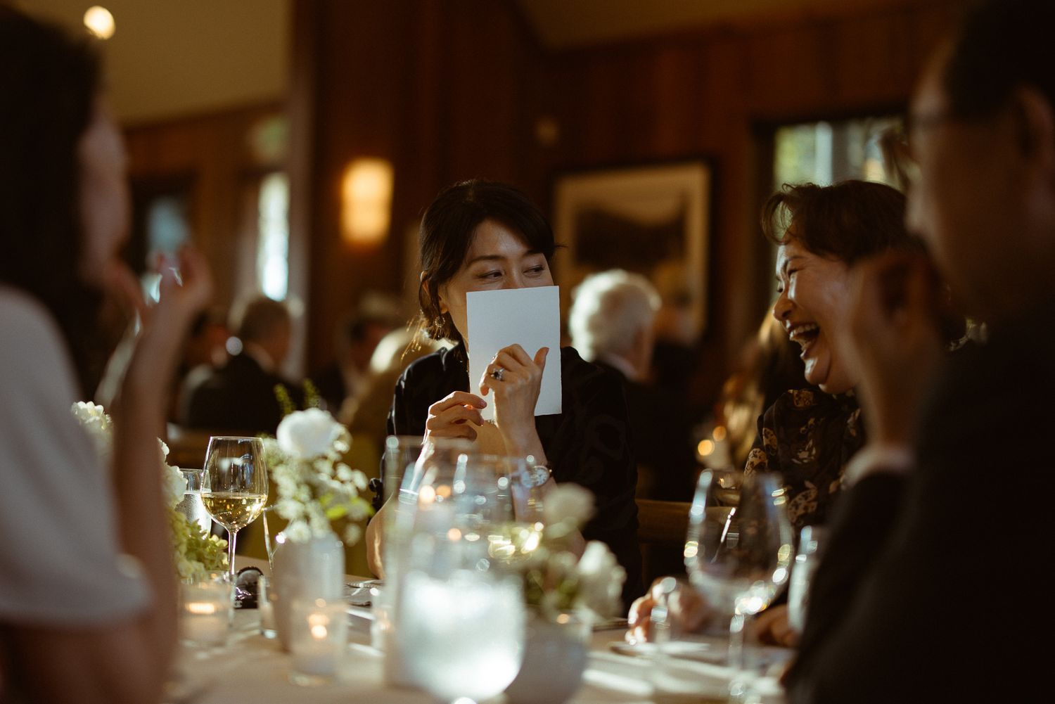 Candid guests enjoying a reception at a Glenbrook wedding on Lake Tahoe, California, by Sammy Aucella Photography