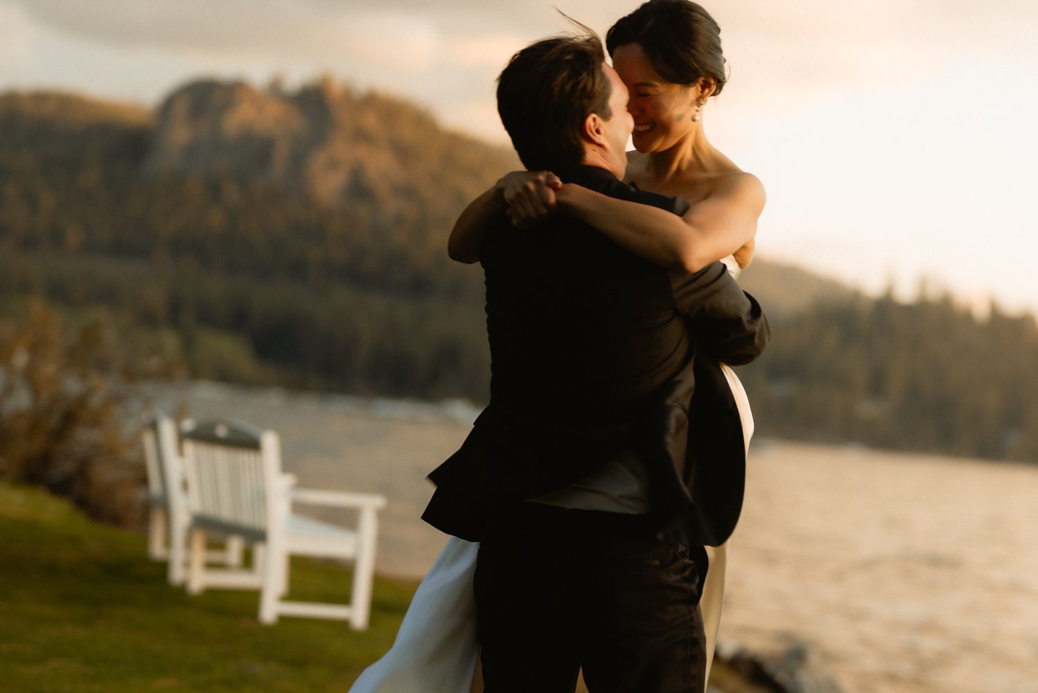 Couple embracing by the lake at sunset during a cinematic Lake Tahoe luxury wedding, by Sammy Aucella Photography