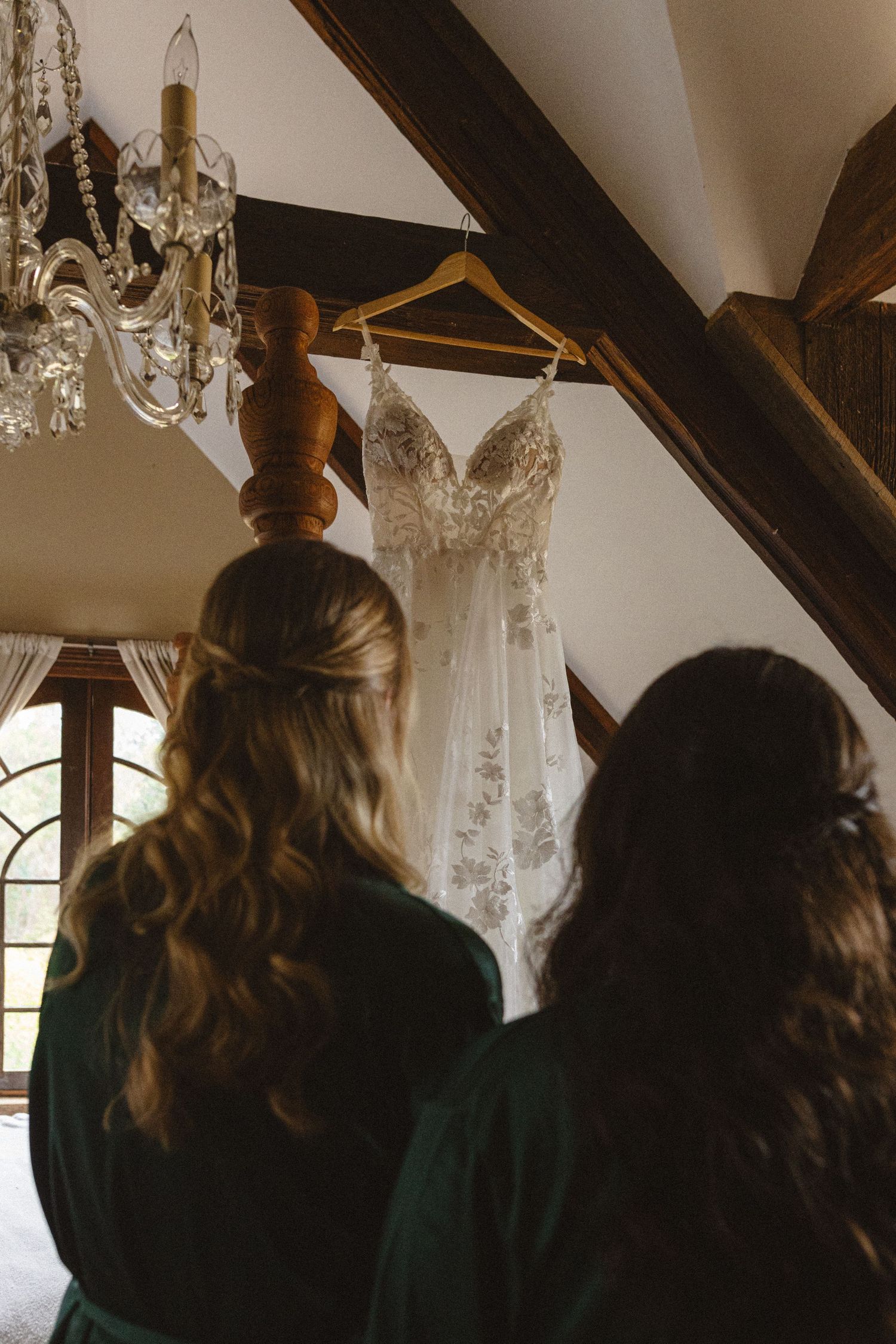 Bride getting ready beside her gown at a Spring Ranch wedding in Mendocino, California, by Sammy Aucella Photography