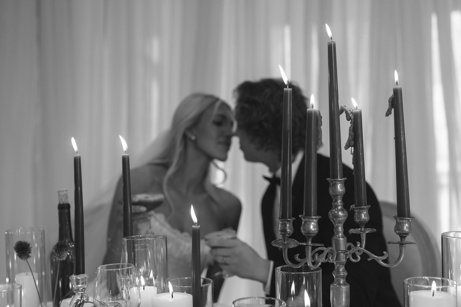 Couple by candlelight and draped windows at The Lodge at Deer Meadows wedding in Utah, by Sammy Aucella Photography