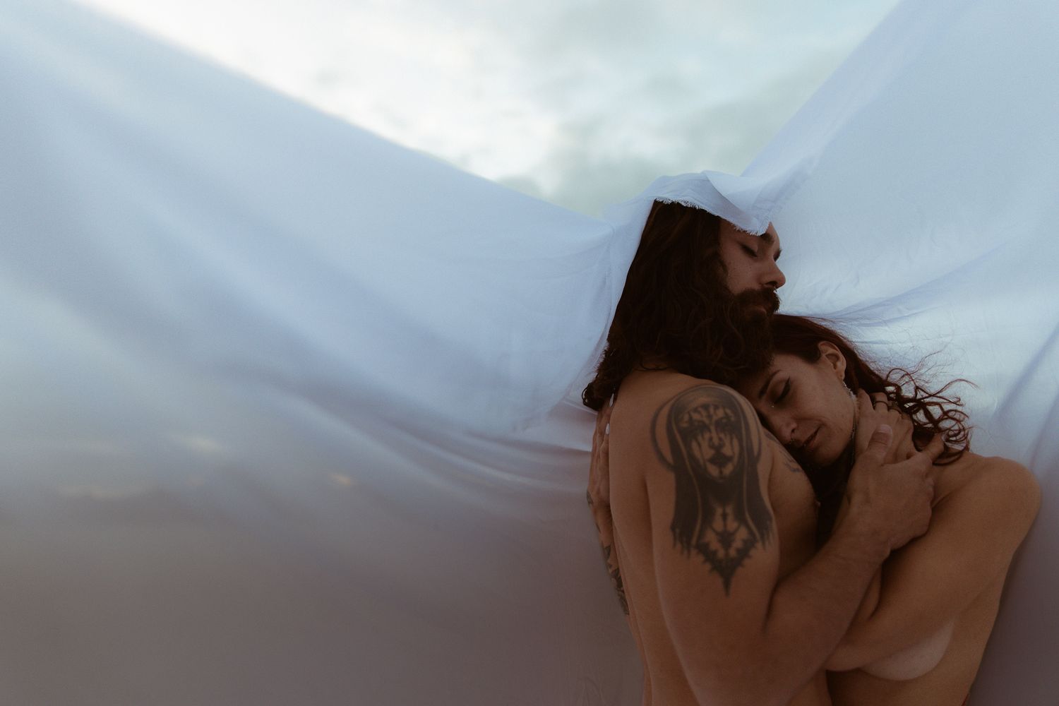 Tasteful nudity couple in love Bonneville Salt Flats in Salt Lake City, UT. Artistic Direction and photography by Sammy Aucella Photography.
