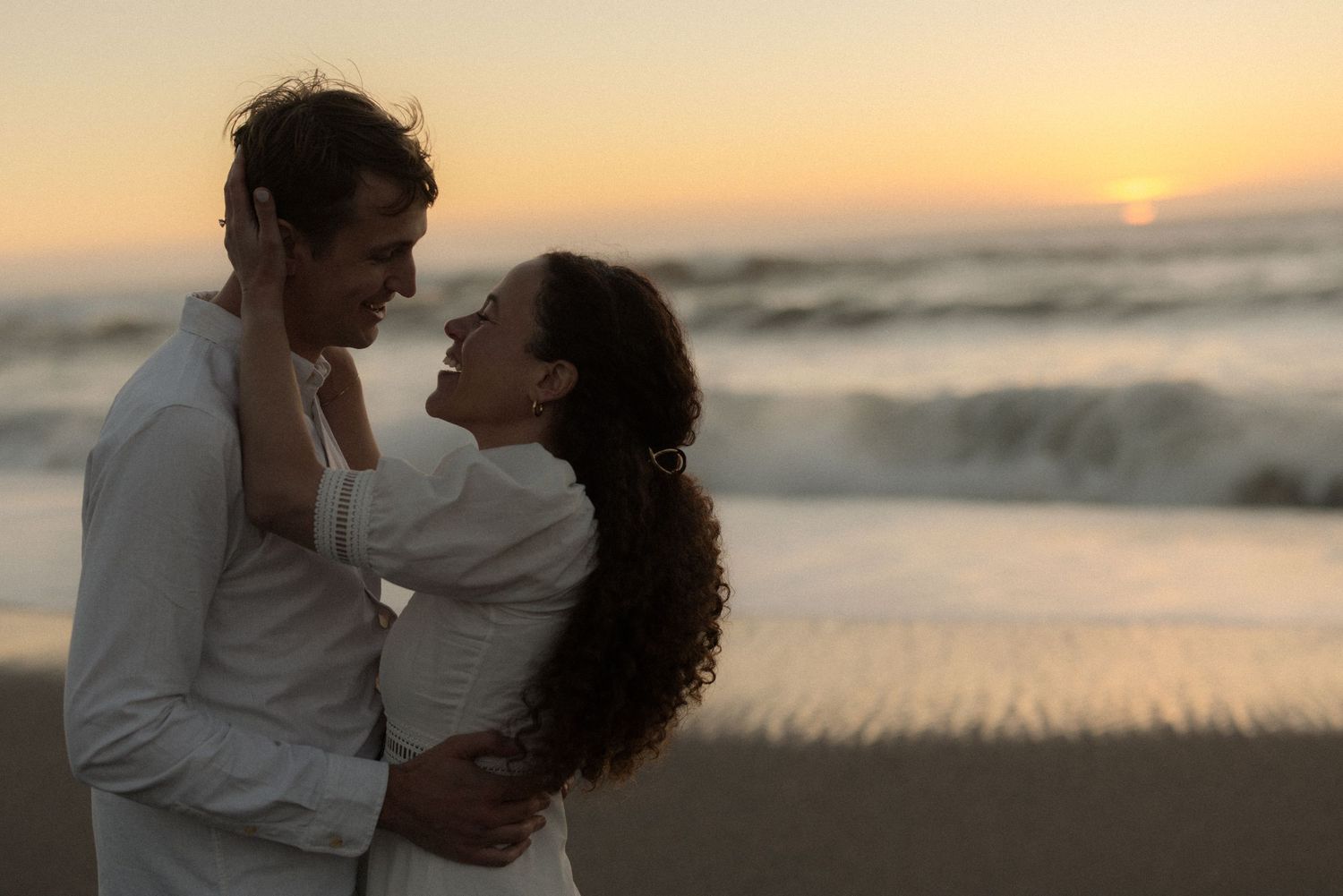 Couple kissing in the ocean during coastal engagement session in Gualala California Mendocino CA by Sammy Aucella Photography