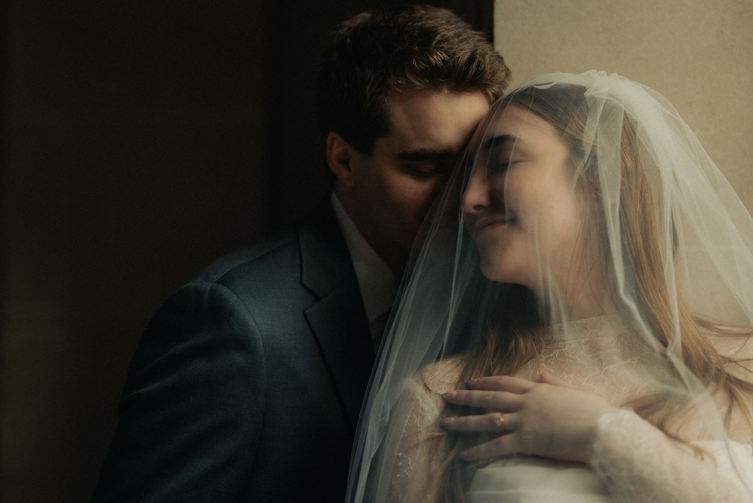 Intimate portrait of the couple under the veil at a San Francisco City Hall elopement, by Sammy Aucella Photography
