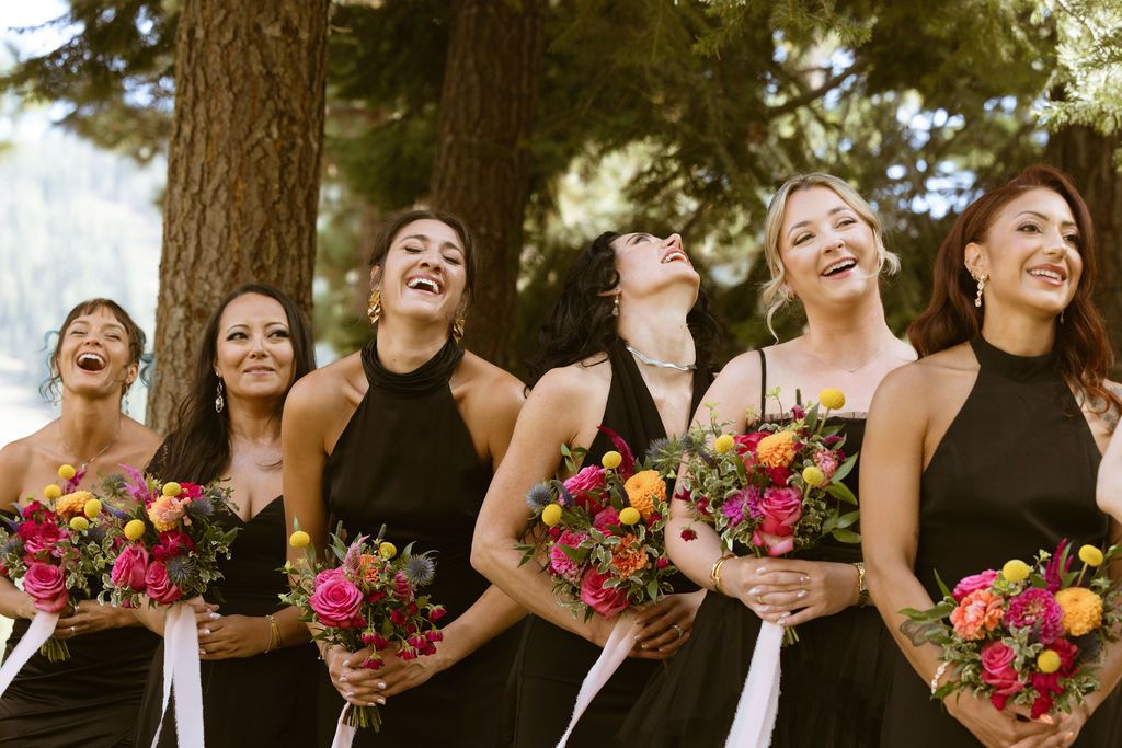 Bridal party laughing with bright bouquets at a Ritz-Carlton Lake Tahoe wedding, by Sammy Aucella Photography