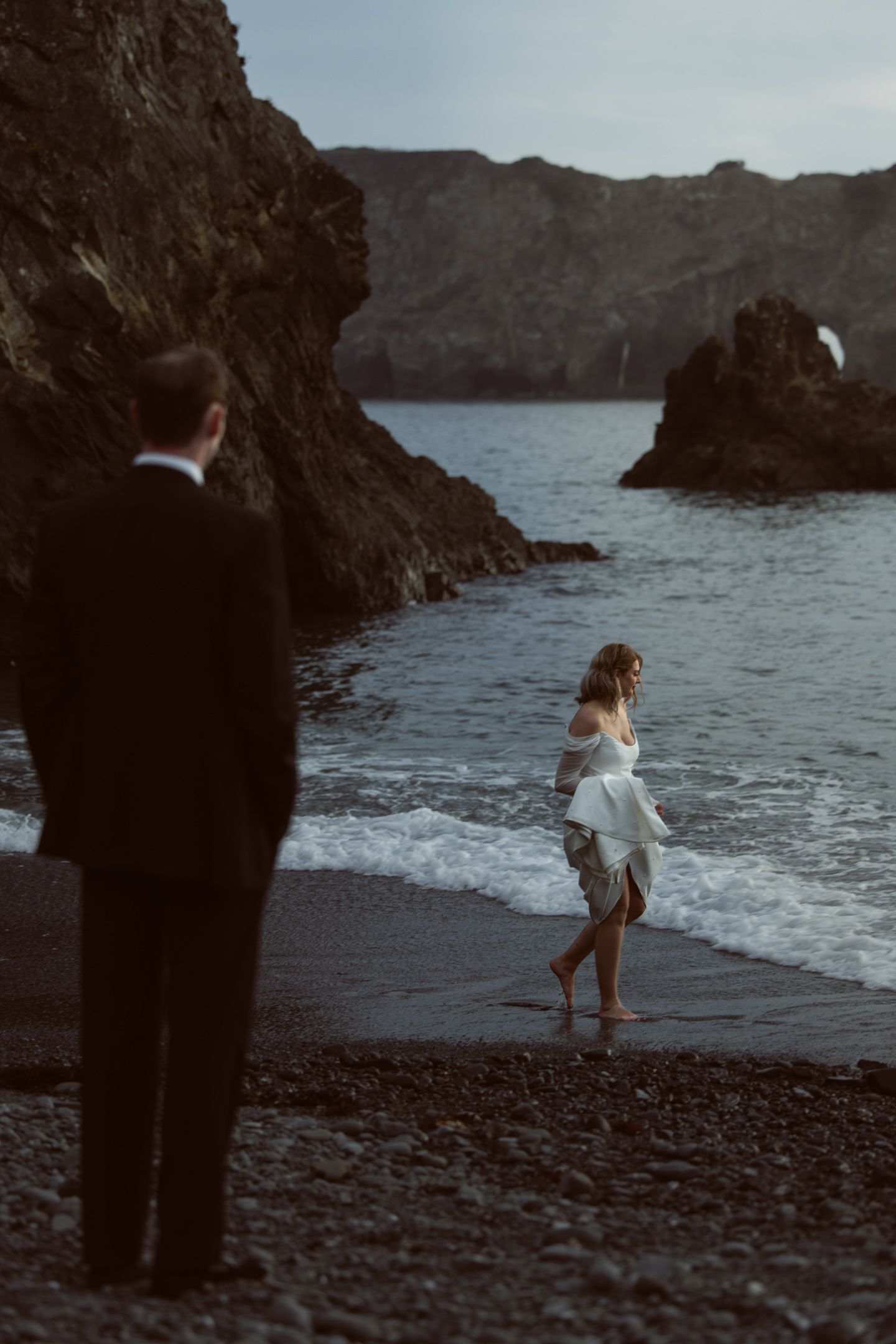 Couple on the ocean cliffs at Harbor House Inn, a coastal Mendocino wedding in Elk, California, by Sammy Aucella Photography