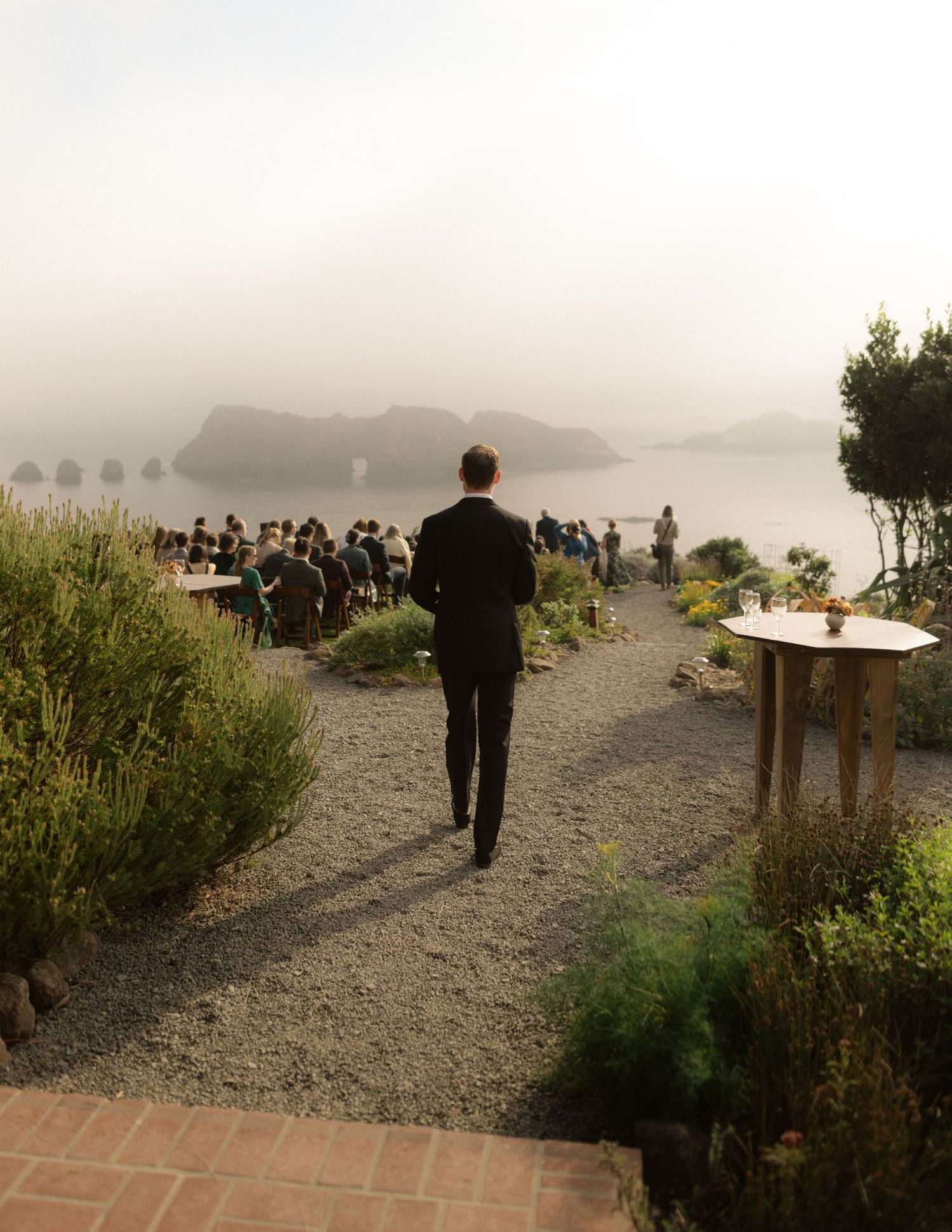 Cliffside ceremony above the ocean fog at Harbor House Inn in Elk, Mendocino, California, by Sammy Aucella Photography