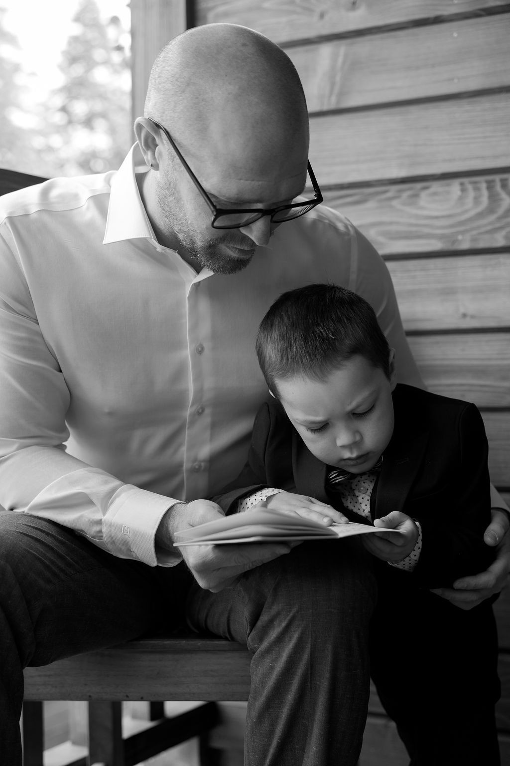 Emotional black and white of a father and son at an Aspen, Colorado luxury wedding, by Sammy Aucella Photography