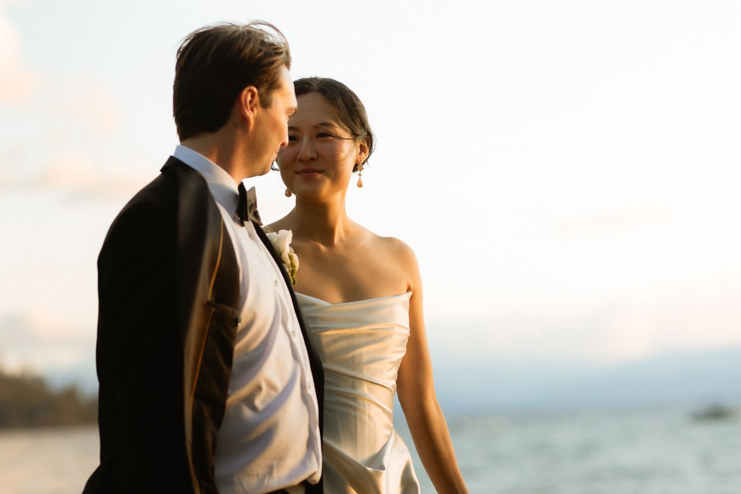 Couple embracing at sunset at a Glenbrook wedding on Lake Tahoe, by Sammy Aucella Photography